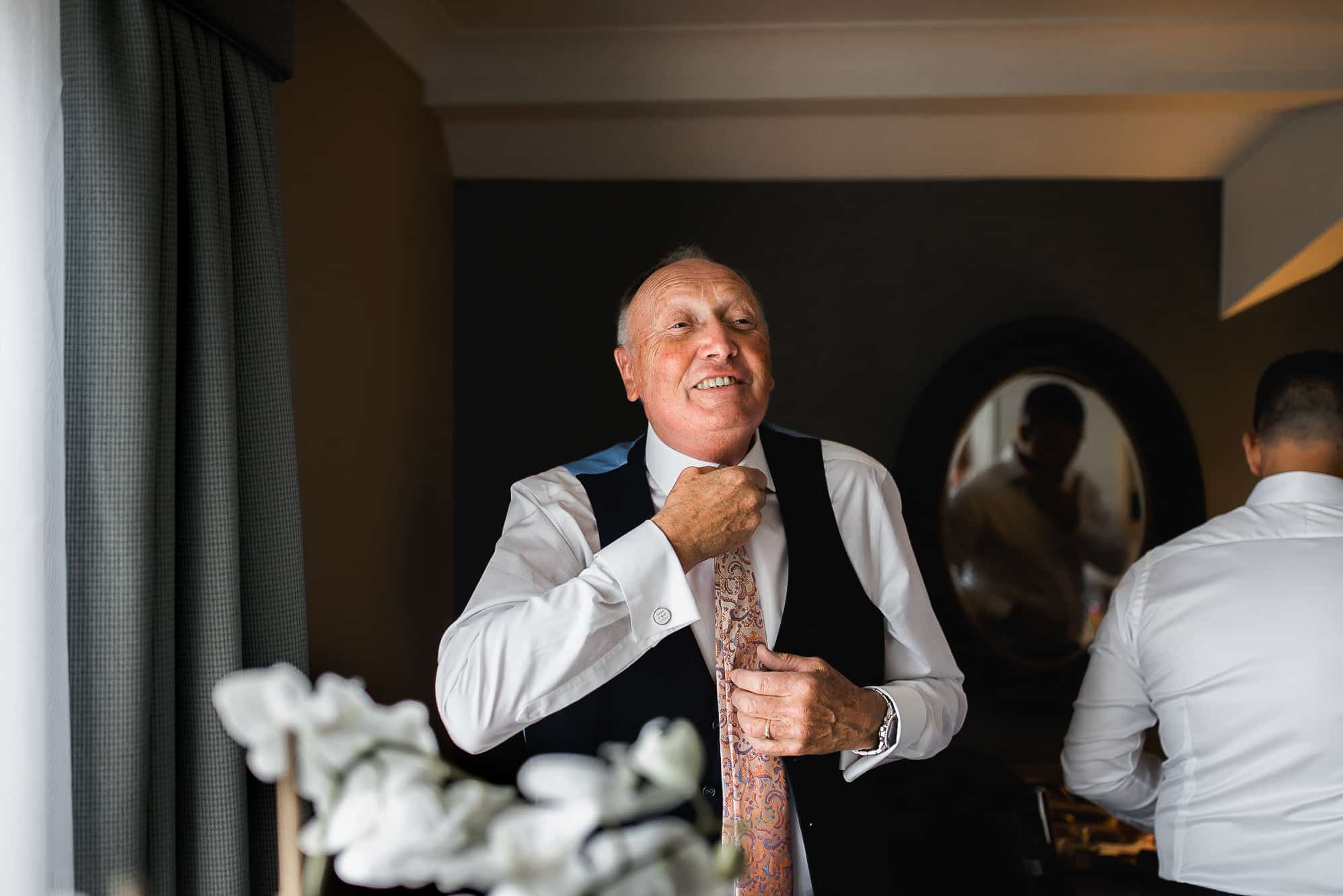 Grandad getting dressed into his suit