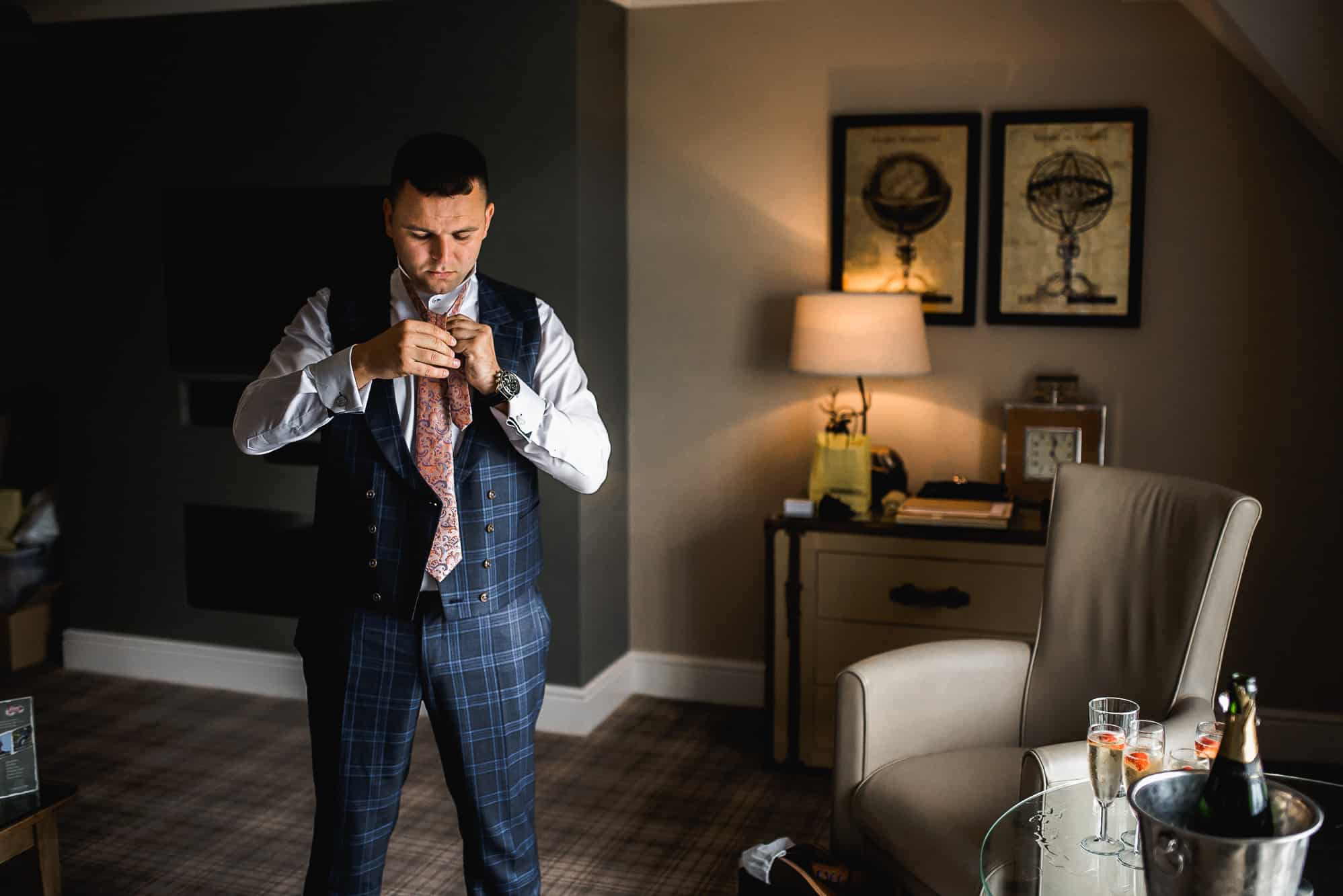 Groom getting dressed