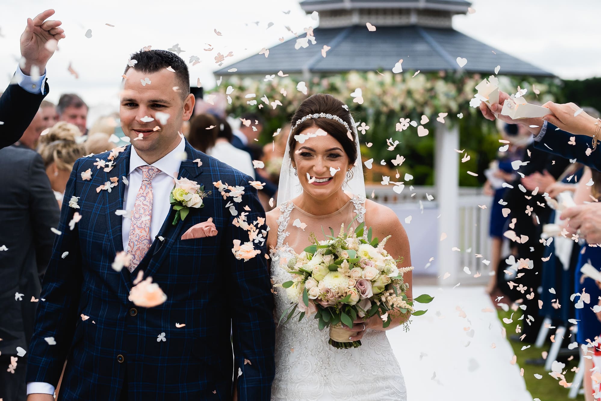 Bride and groom with confetti
