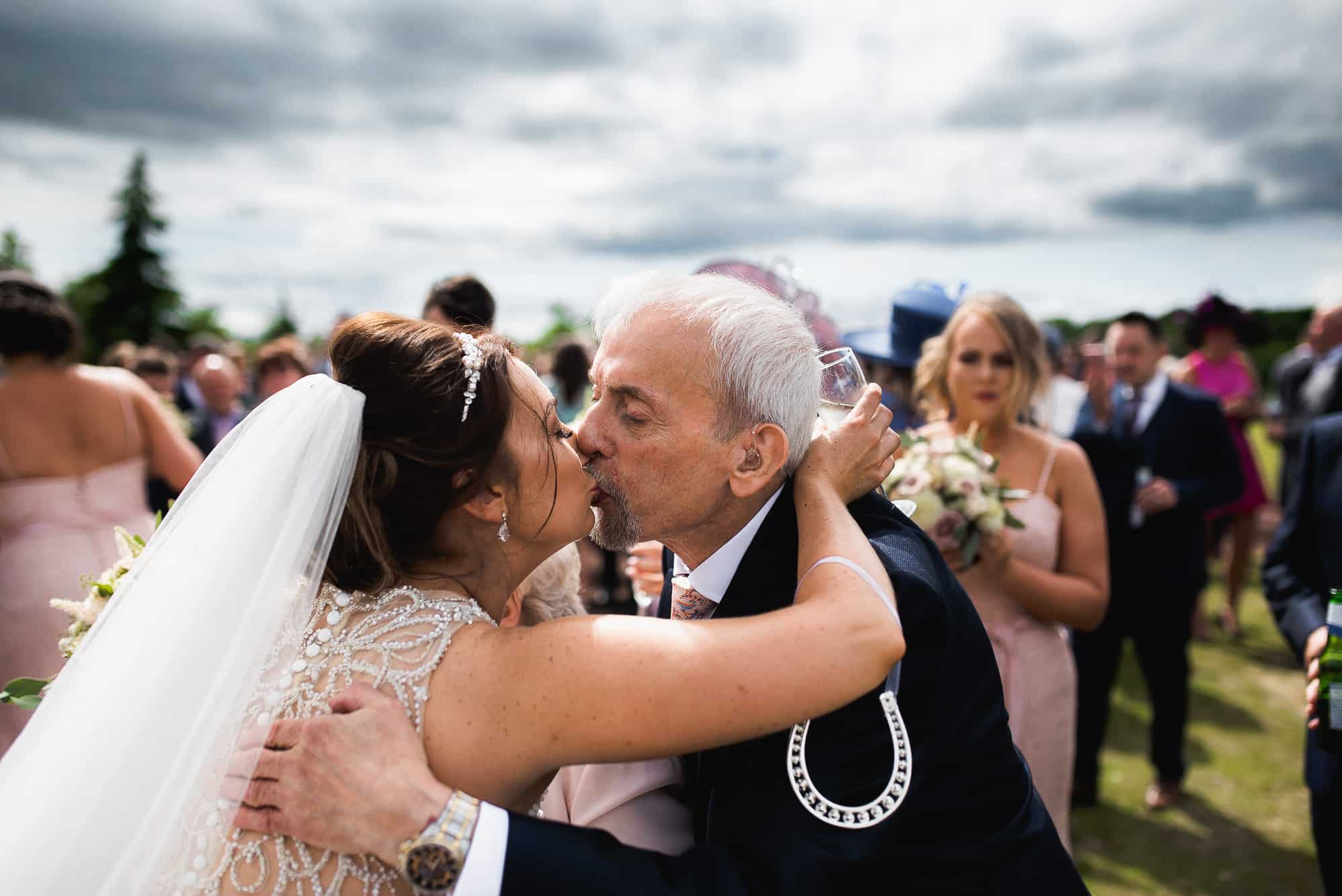 Bride kissing her grandad