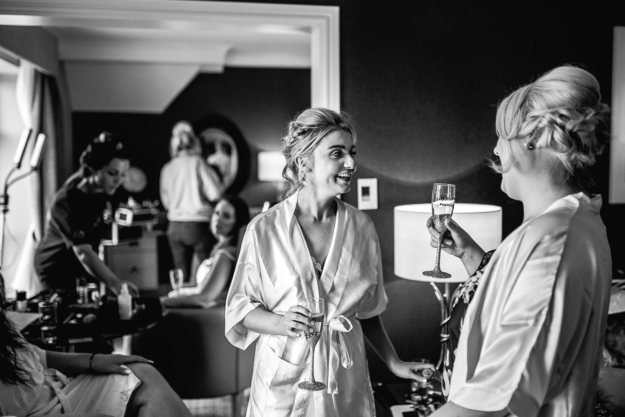 Bridesmaids getting ready and laughing
