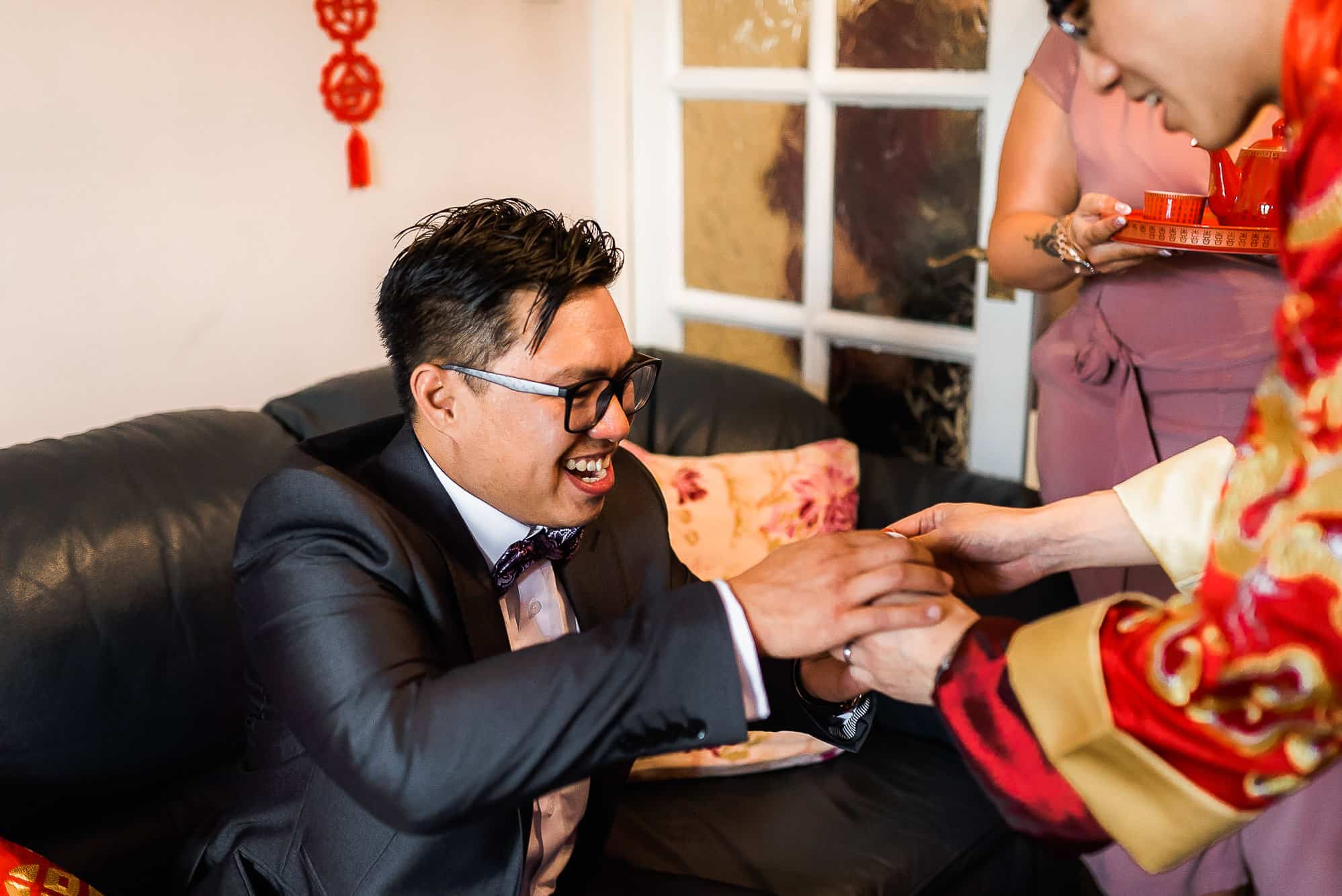 Chinese Wedding Photography | Manchester | Ray & Julie 22 Groom having tea from groom