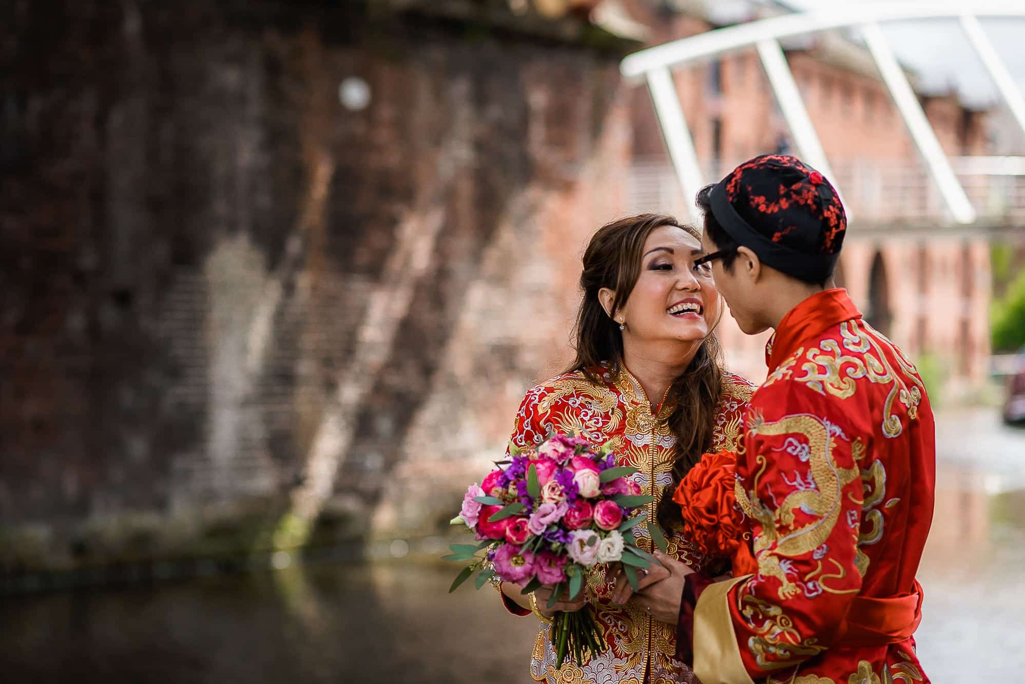 Chinese Wedding Photography | Manchester | Ray & Julie 25 Bride and groom under a bridge at Castlefield