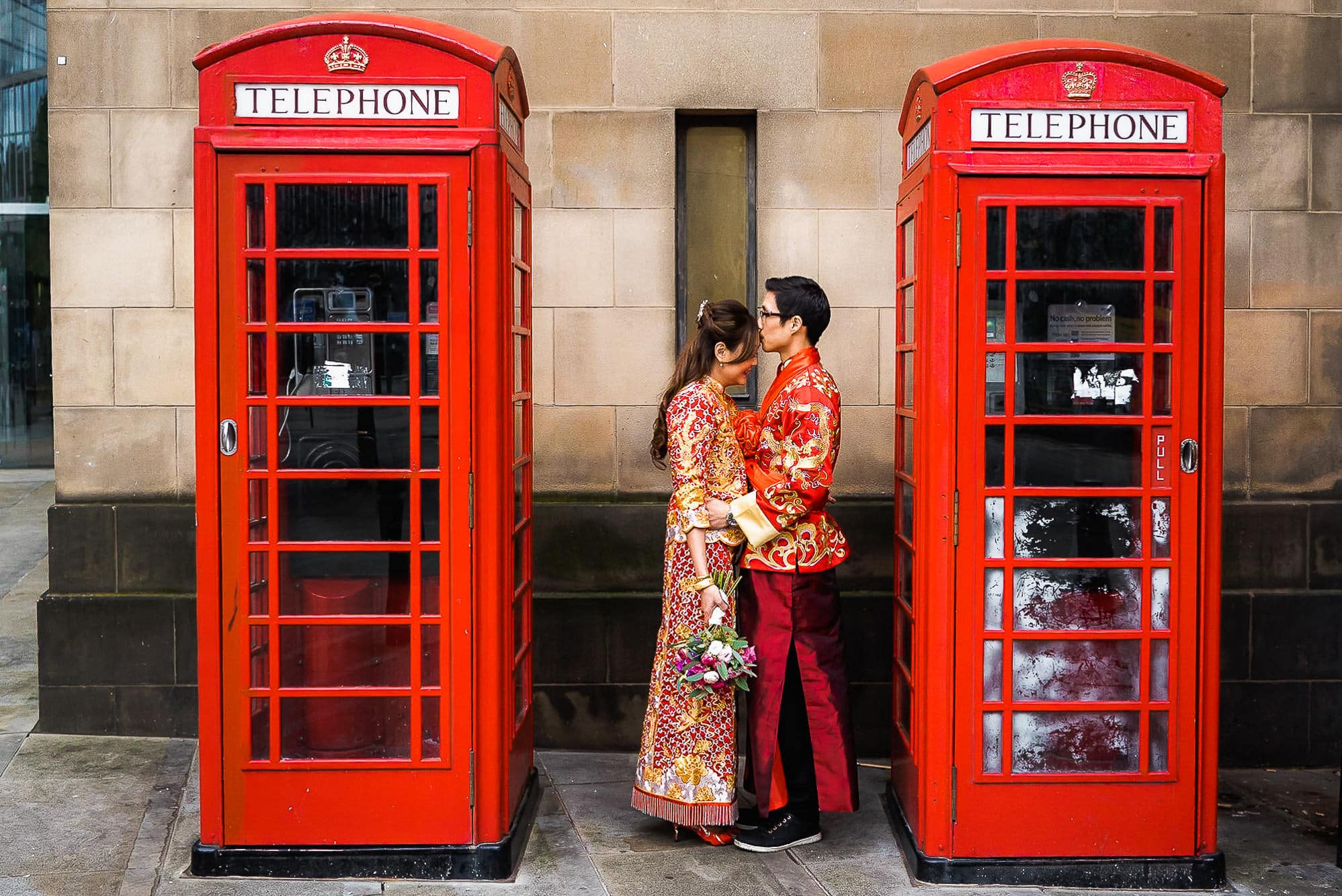 Chinese Wedding Photography | Manchester | Ray & Julie 31 Cuddling outside phone box
