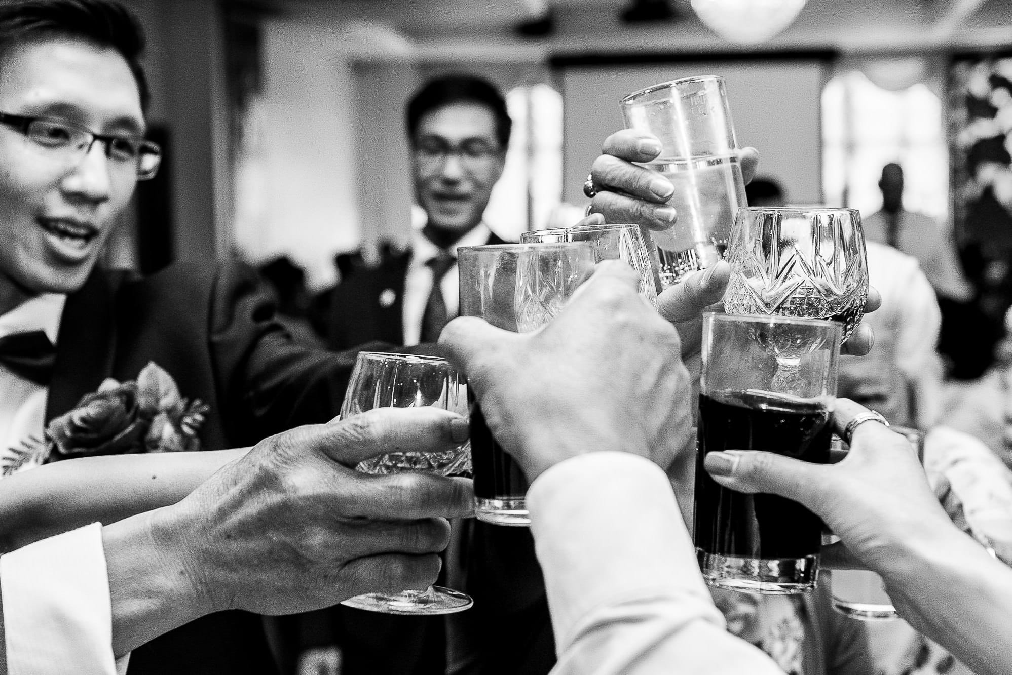 Chinese Wedding Photography | Manchester | Ray & Julie 40 Drinking at a table