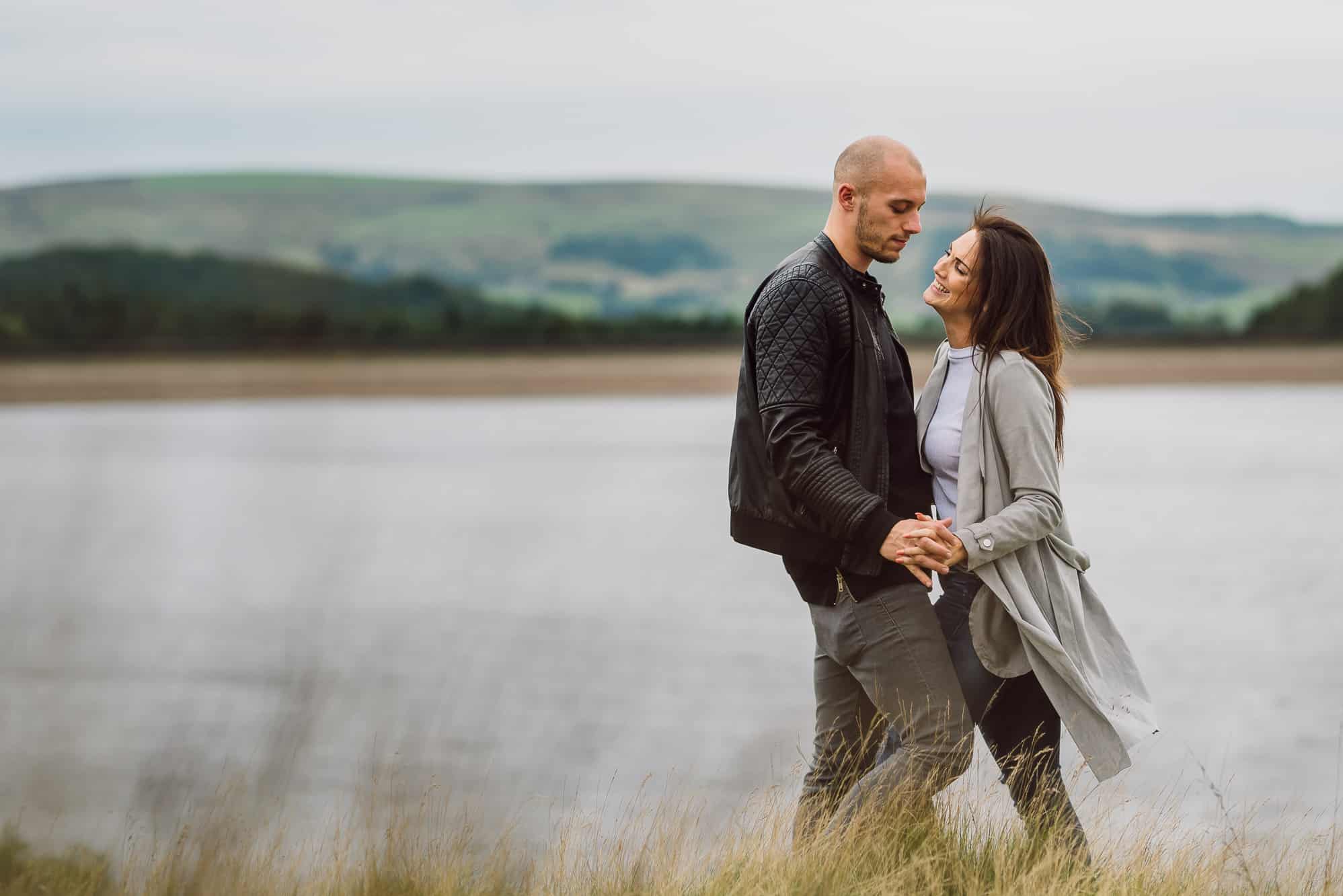 laughing couple with reservoir behind