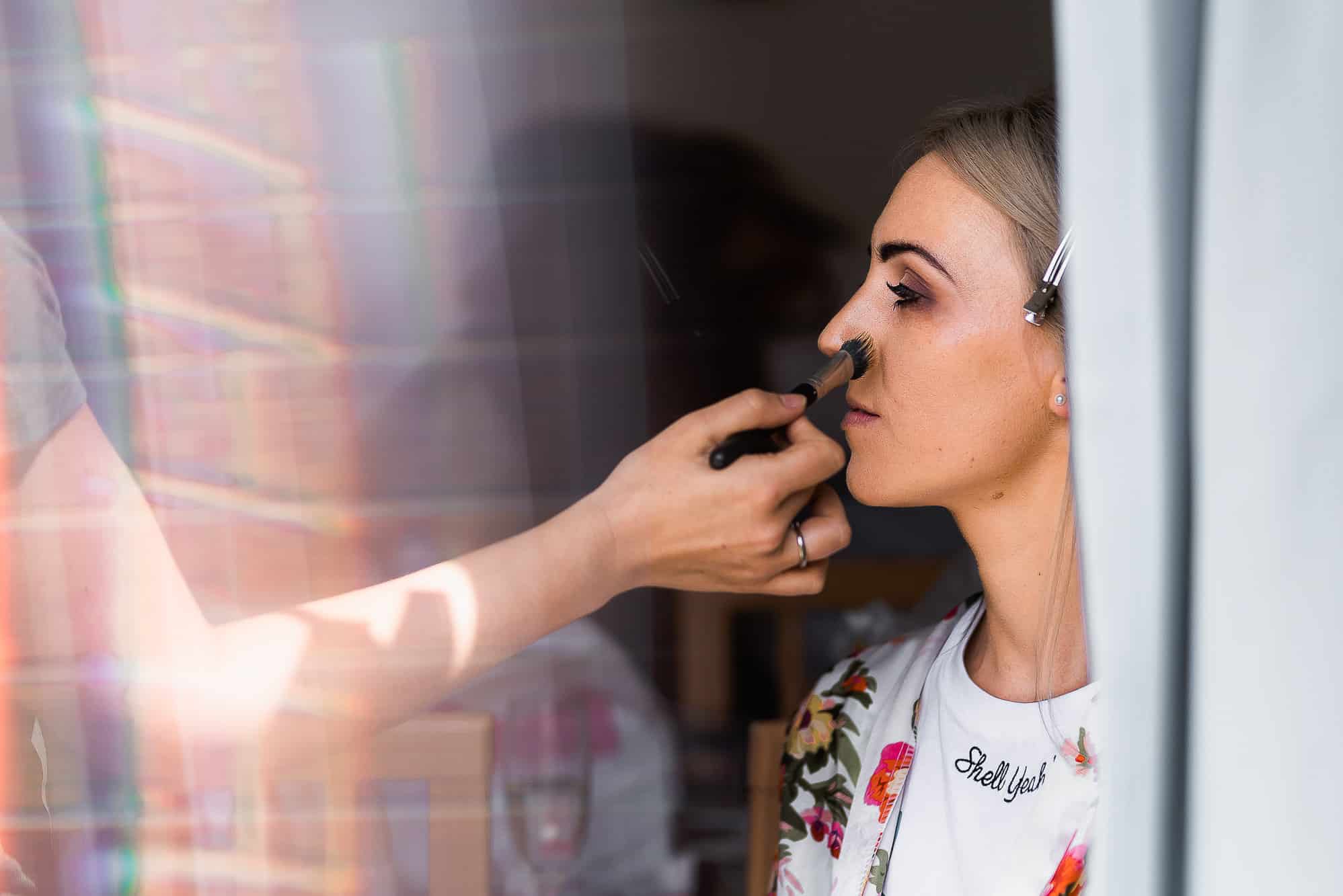 Bride having her make up done 