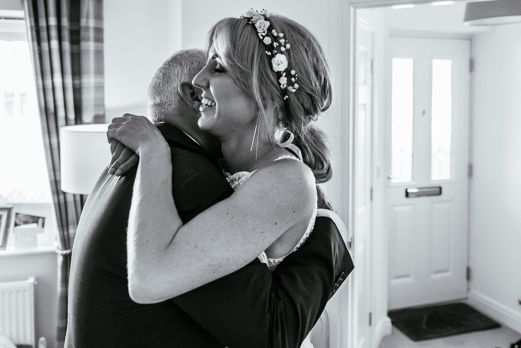 bride and dad hugging