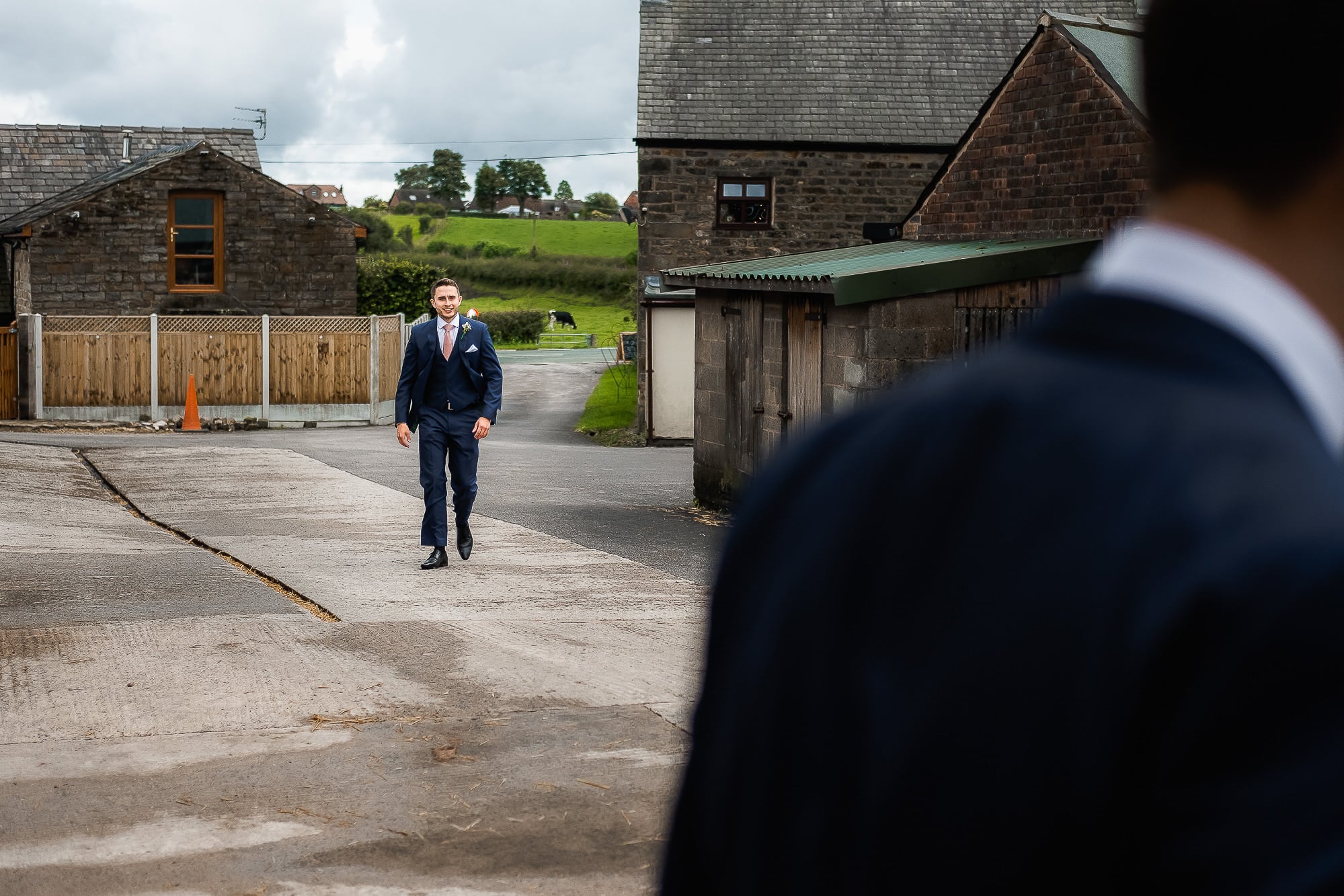 groom walking through the farm
