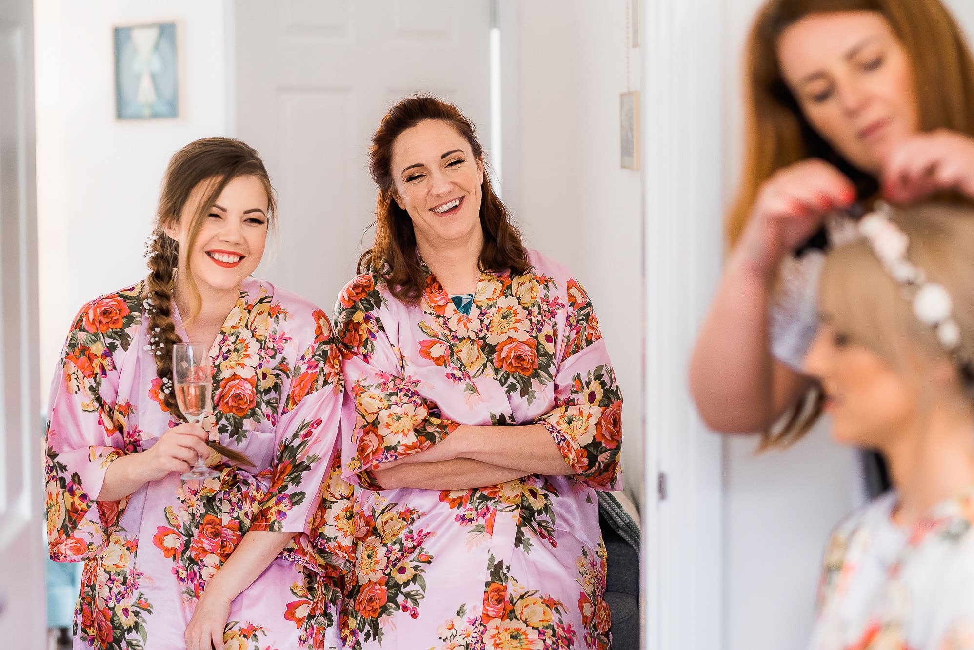 bridesmaids laughing with bride