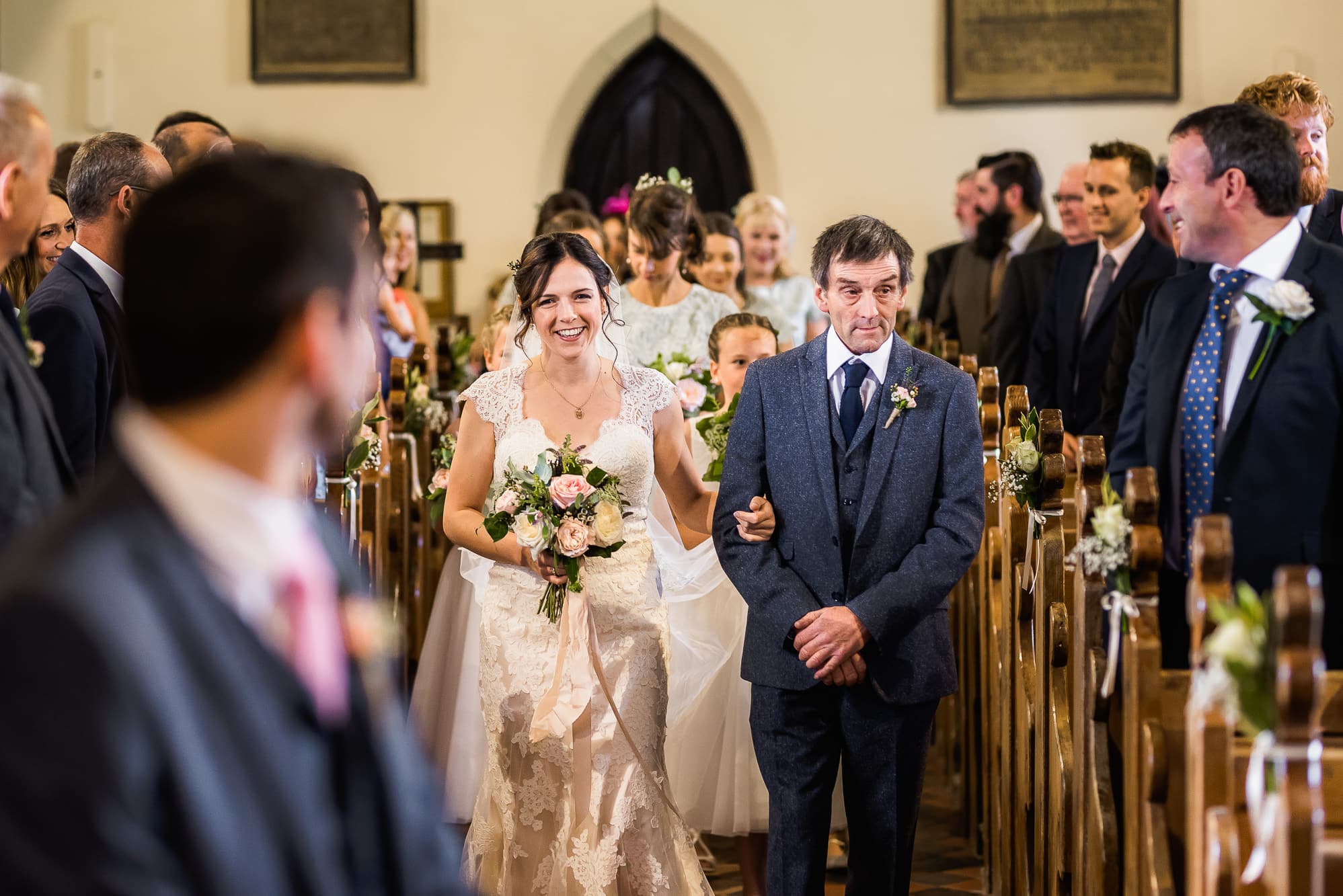 Bride walking down aisle with her dad