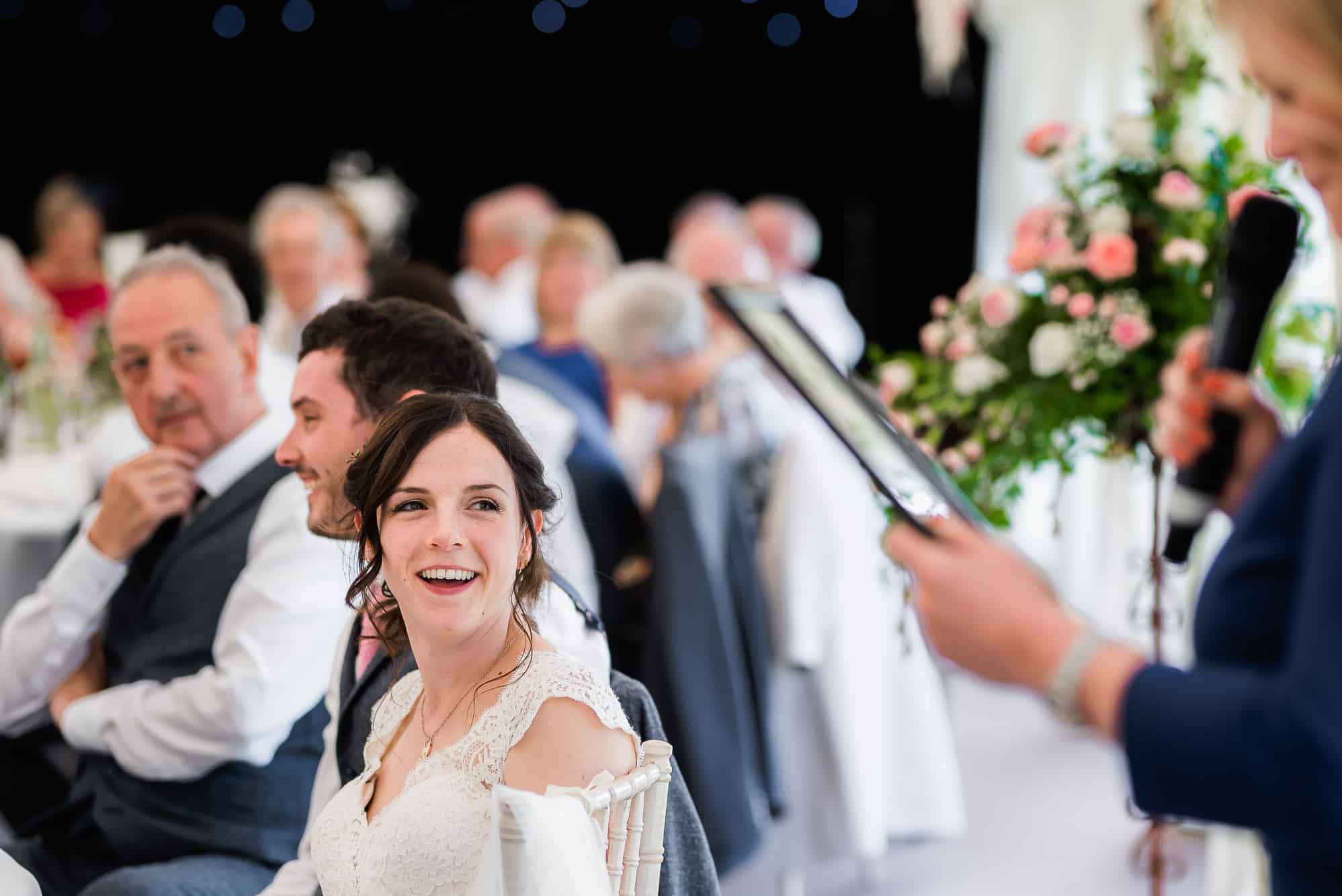 bride looking at someone doing a reading