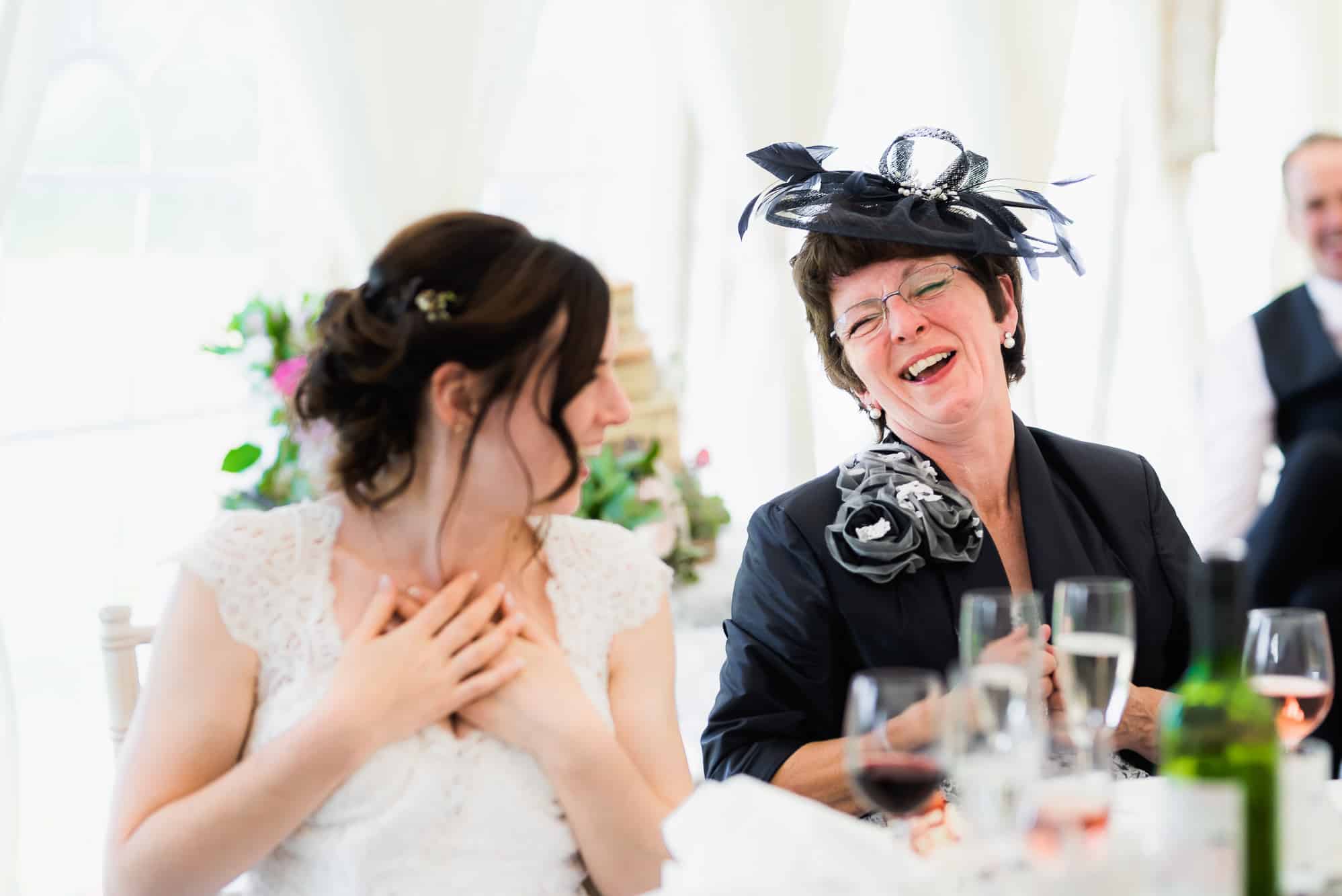 Bride and her mum laughing