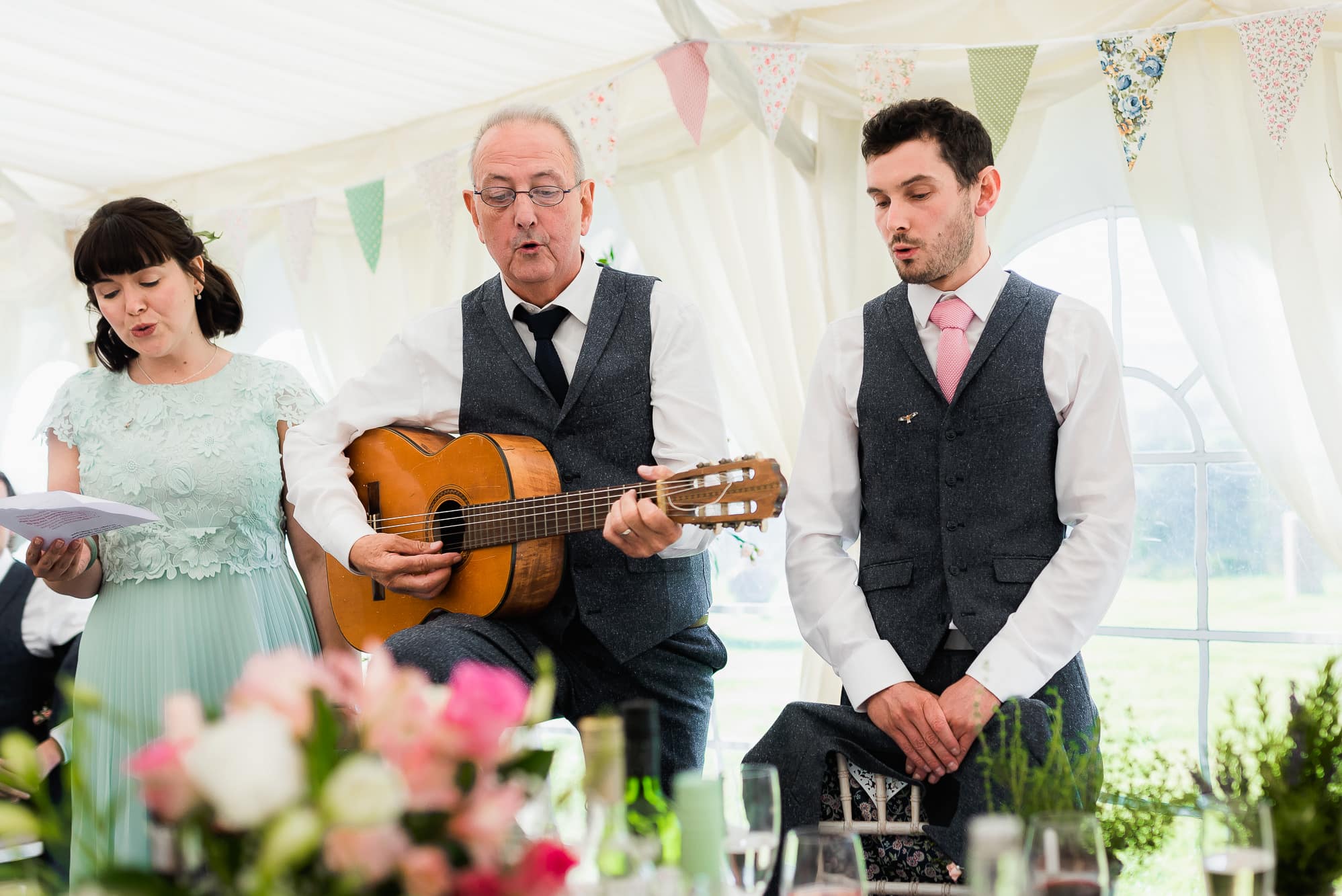 Groom, his sister and dad singing