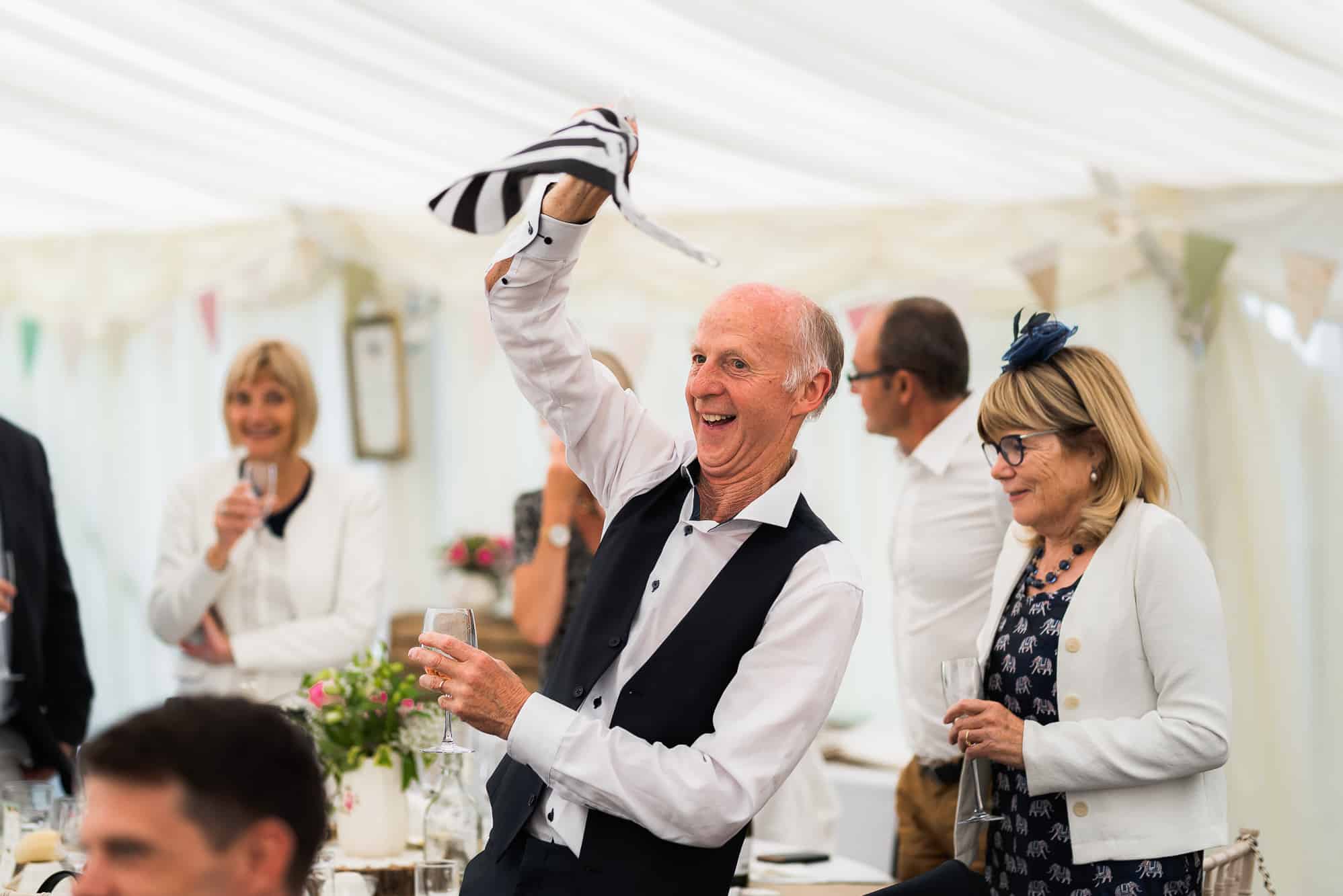 Male guest waving his hanky