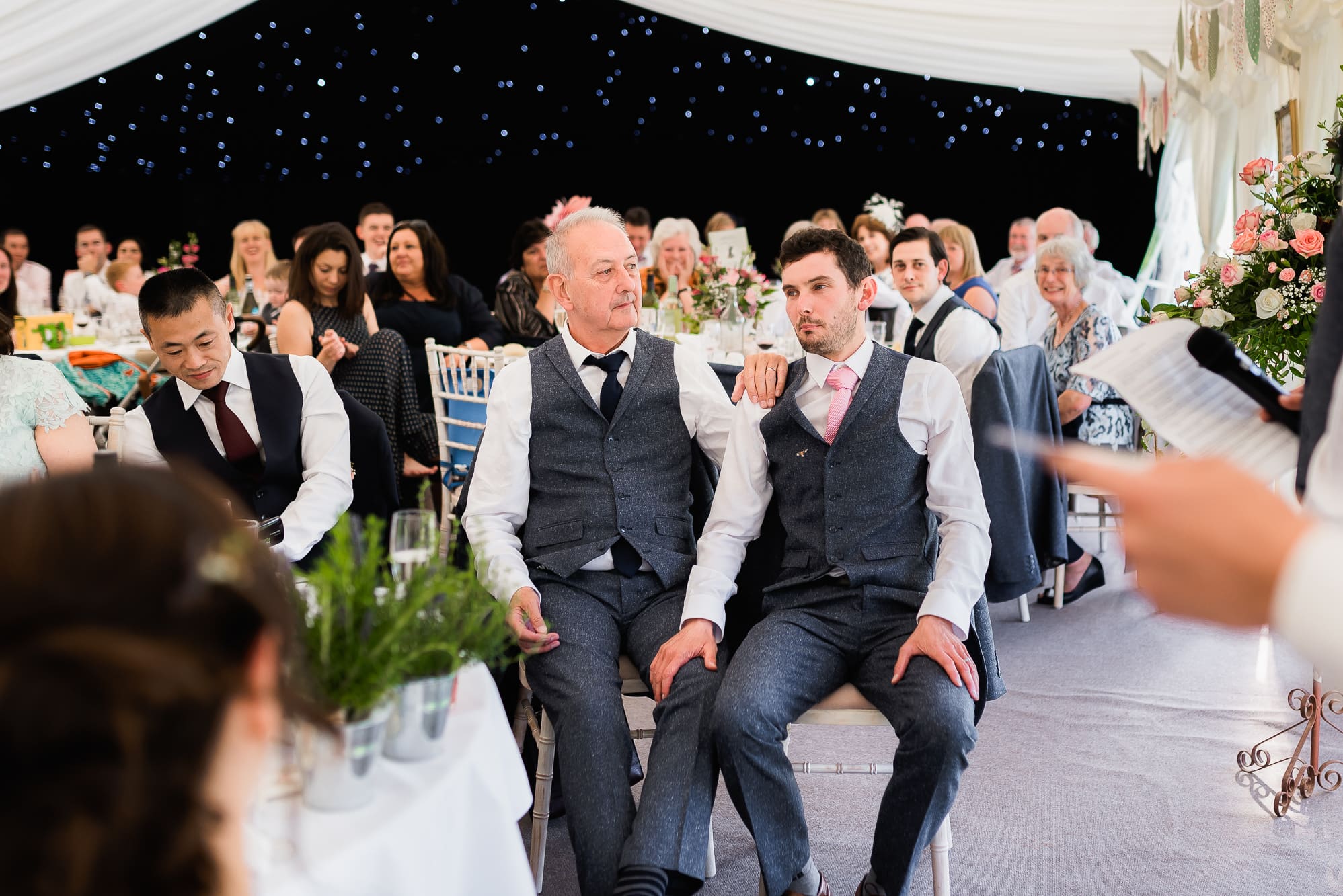 gROOM HOLDING HIS DADS LEG