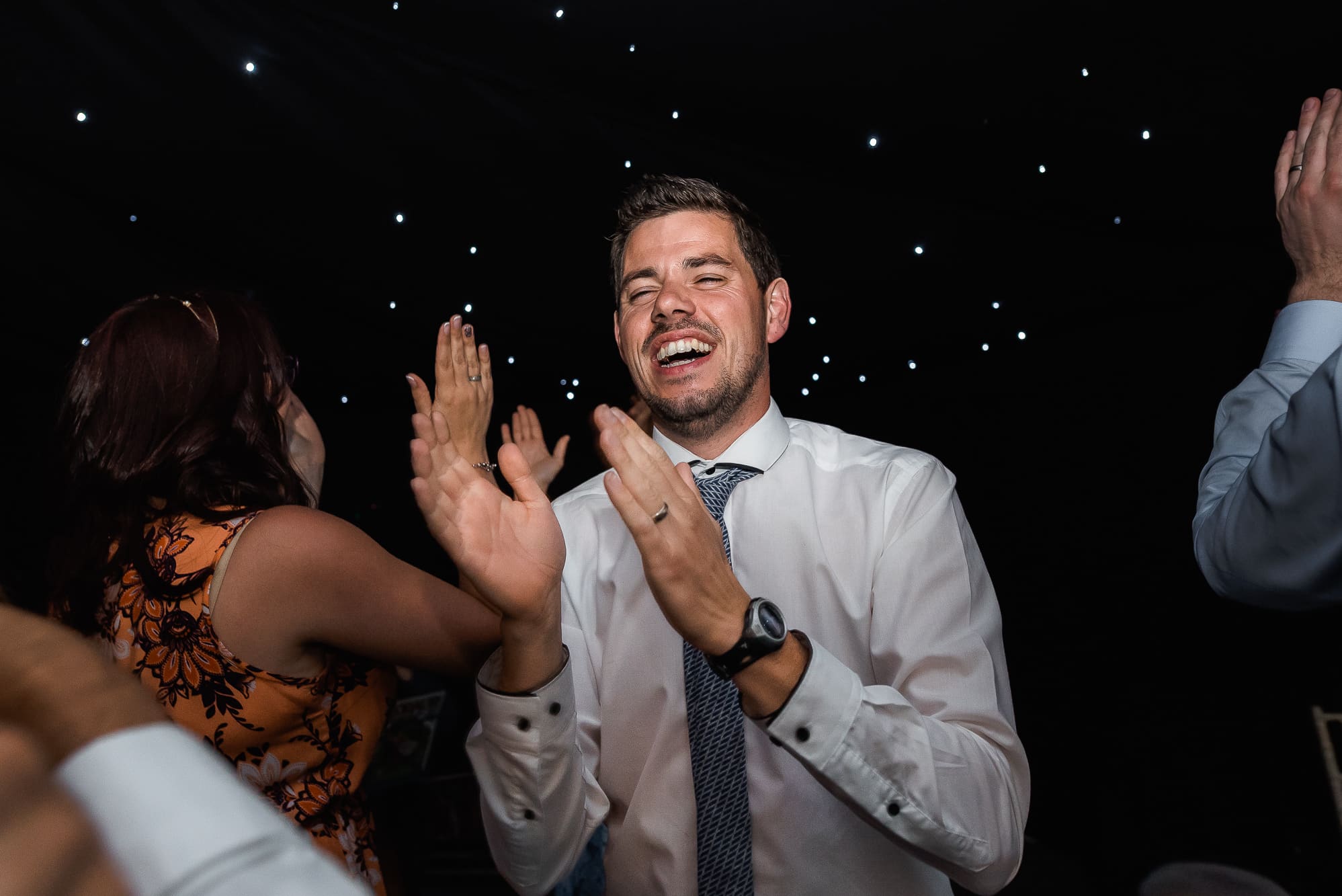 Guest dancing and clapping