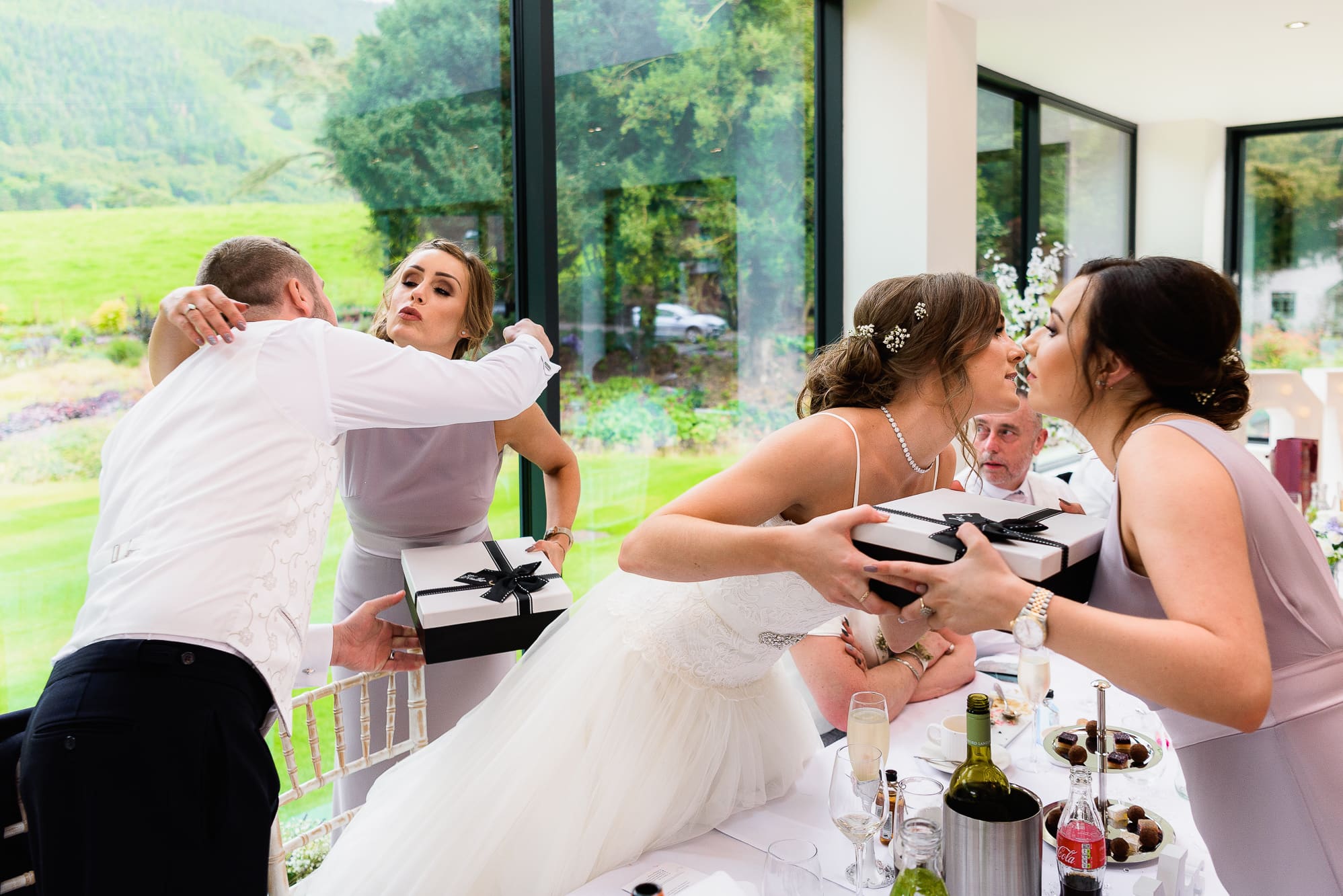 Tyn Dwr Hall Wedding Photography | Andy Griffiths Photography 38 Cuddles all around at Tyn Dwr Hall during the wedding breakfast