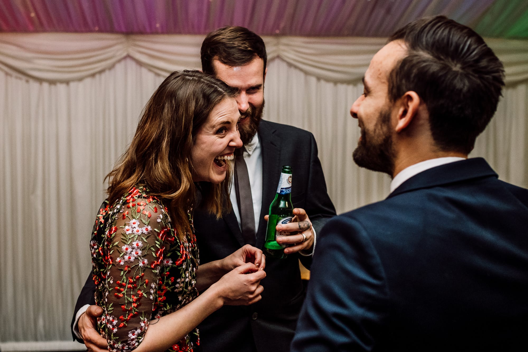 Winter Wedding Photography at Heaton House Farm 22 Female guest laughing at Heaton House Farm