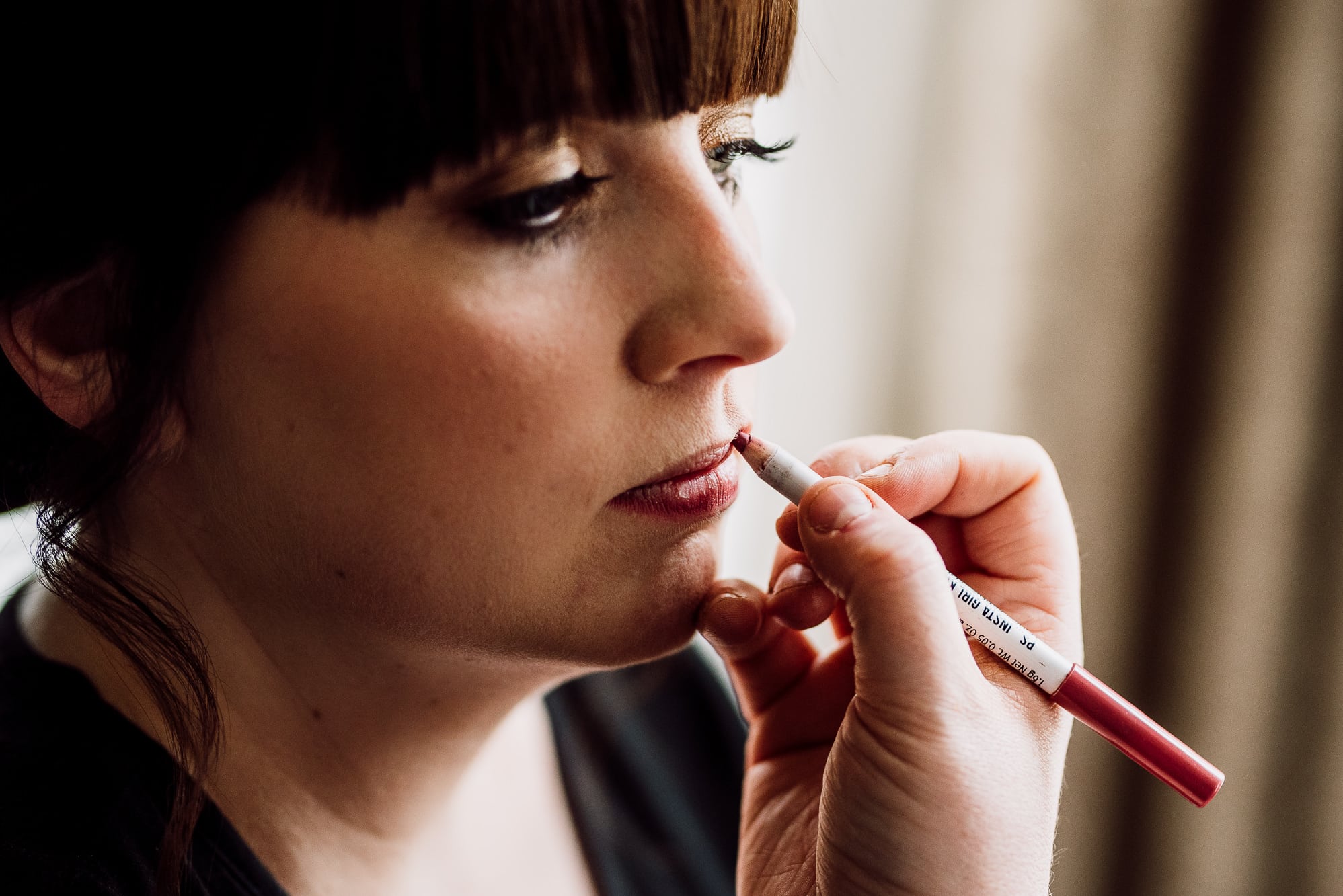 Crabwall Manor Wedding Photography | Mark & Beth 2 The bride is having the finishing touches done before she gets married at Crabwall Manor