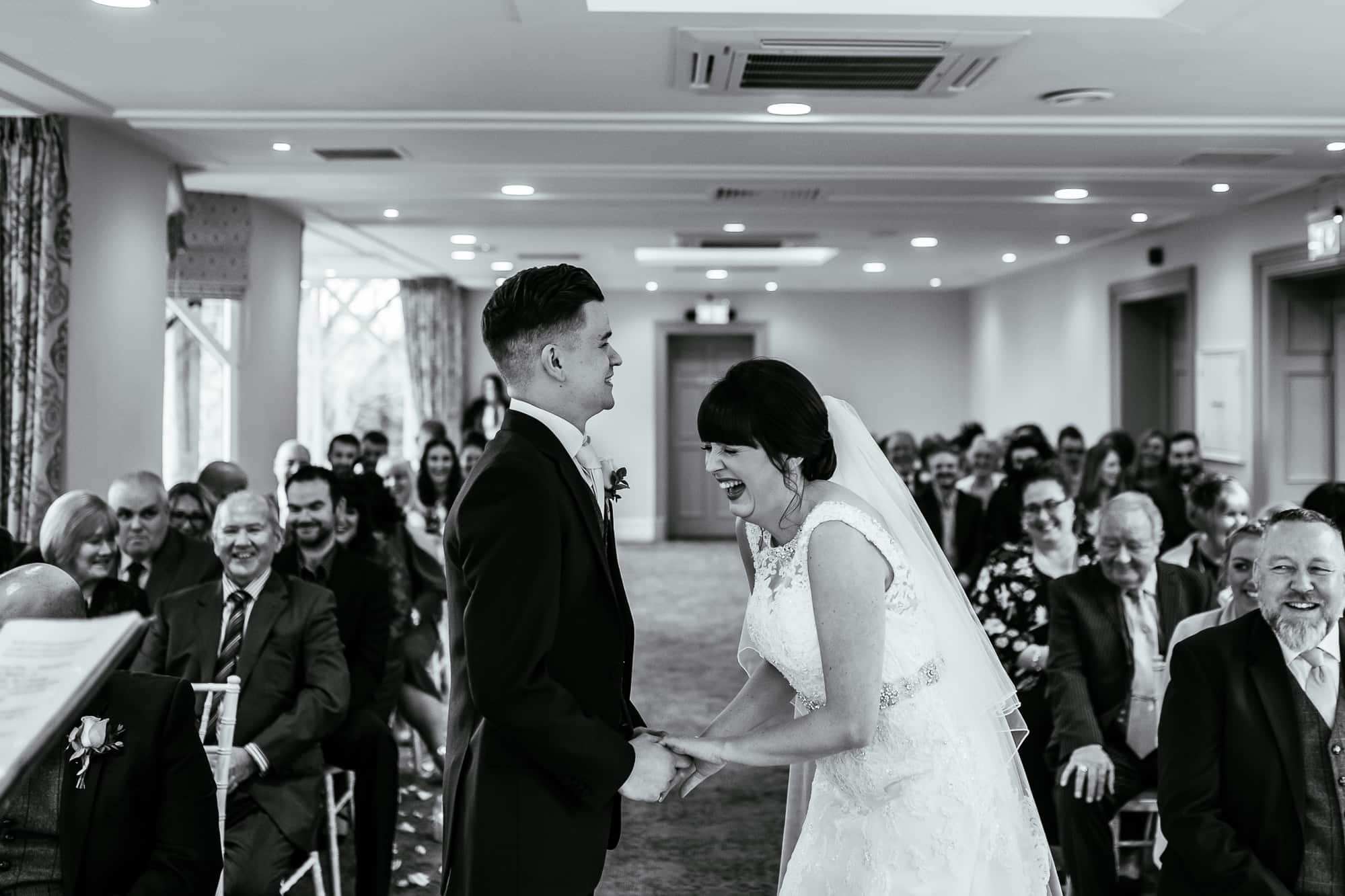 Crabwall Manor Wedding Photography | Mark & Beth 13 Bride is laughing after getting married