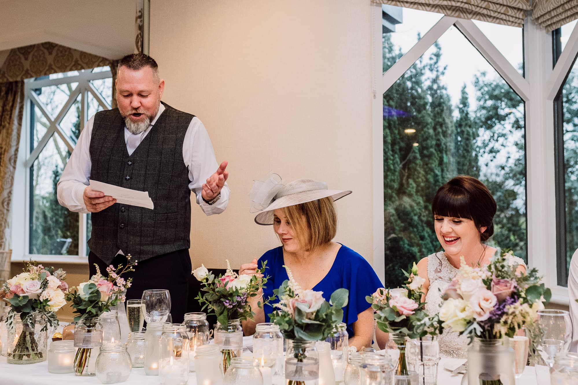 Crabwall Manor Wedding Photography | Mark & Beth 20 Father of the bride speech as bride laughs