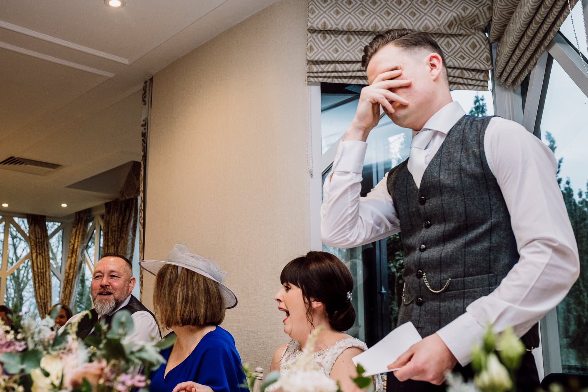 Crabwall Manor Wedding Photography | Mark & Beth 22 Groom covers his face as Crabwall Manor