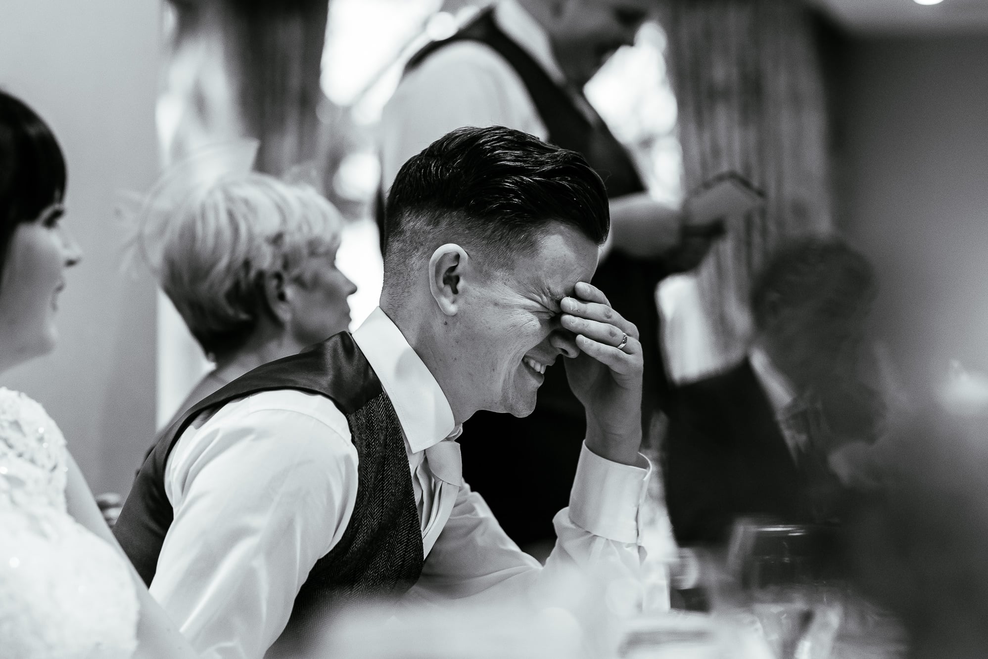 Crabwall Manor Wedding Photography | Mark & Beth 24 Groom holds his head as the best man speaks behind him