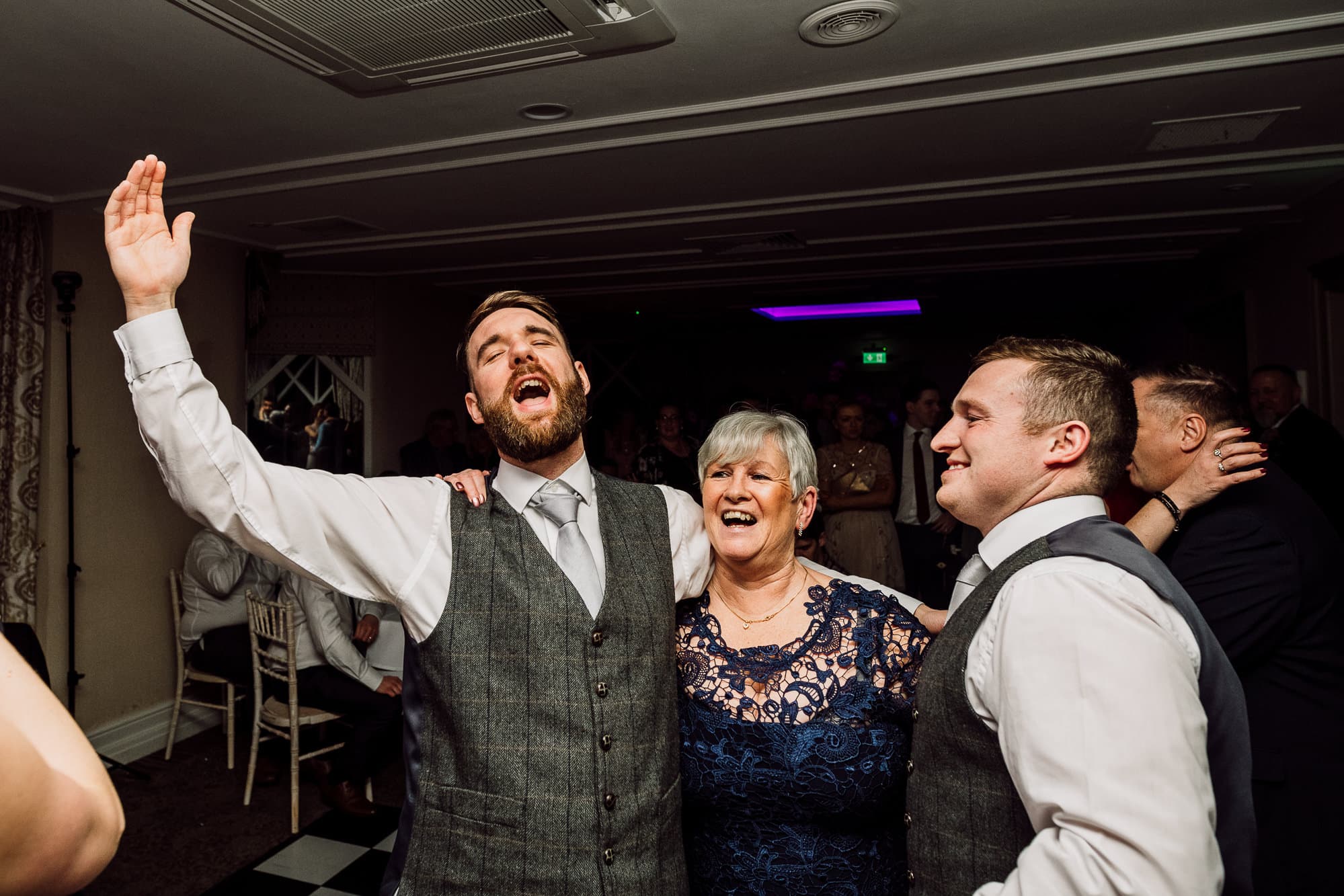 Crabwall Manor Wedding Photography | Mark & Beth 25 Ushers are dancing with the mother of the groom