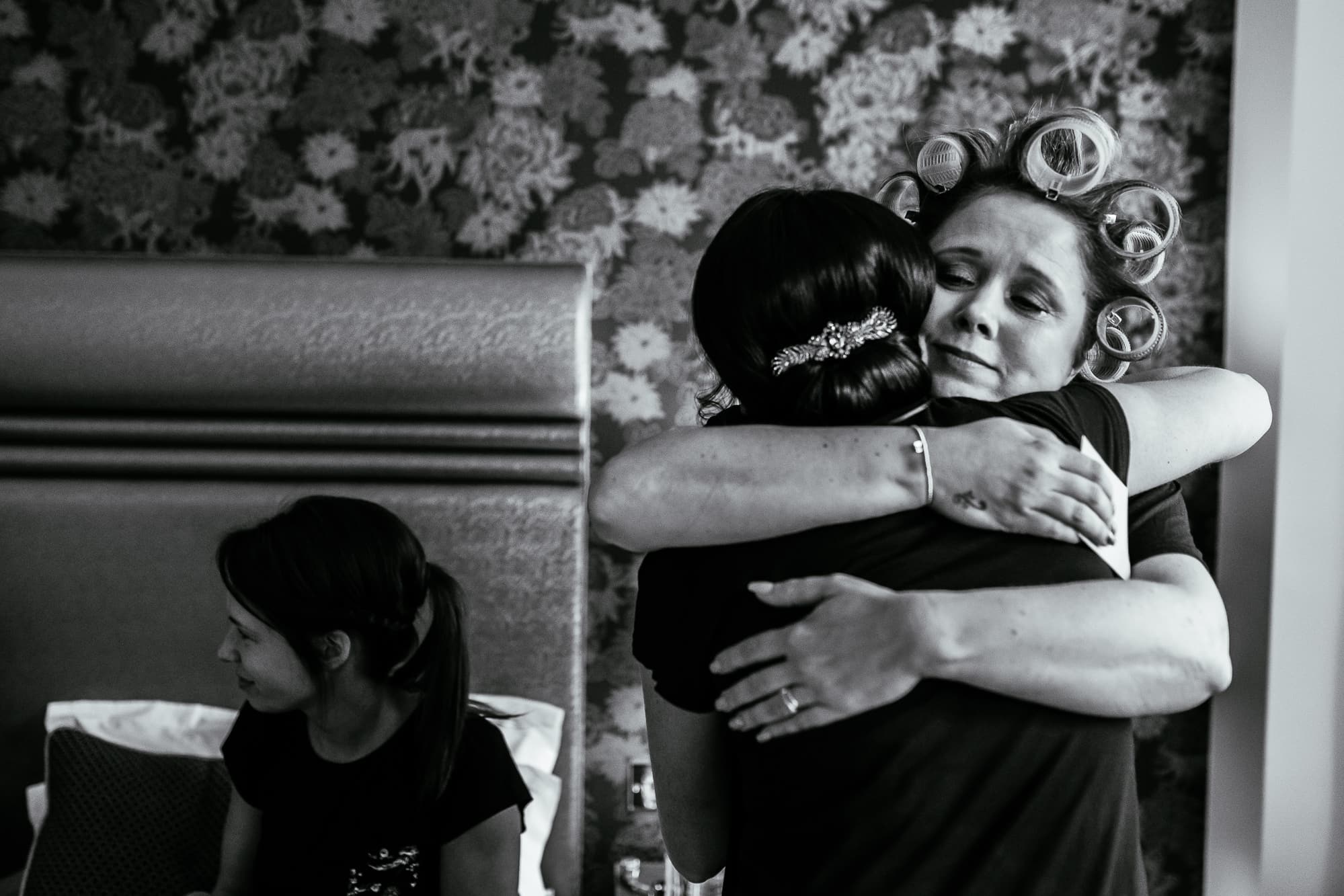 Crabwall Manor Wedding Photography | Mark & Beth 4 The bride and her mum hug after exchanging gifts