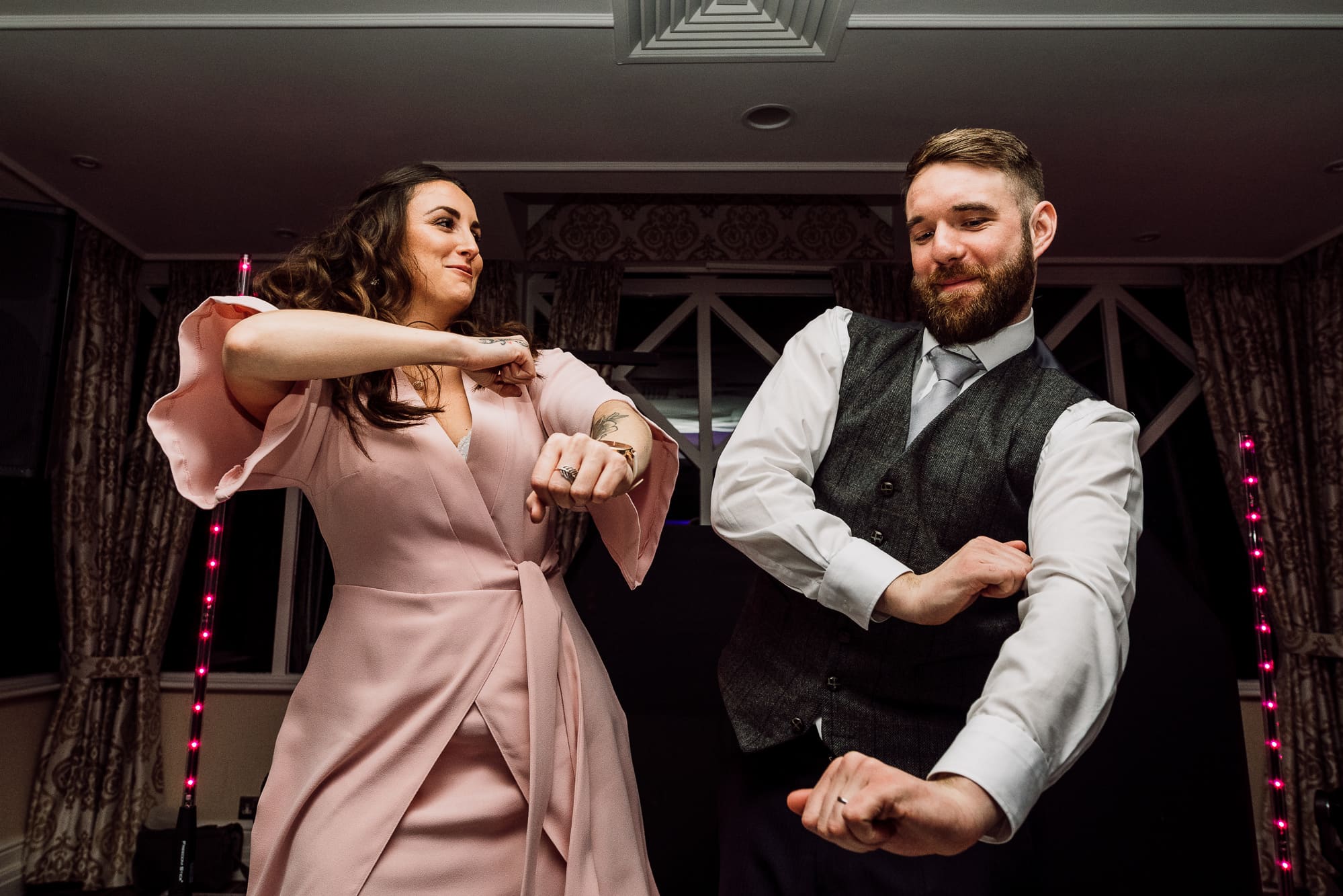 Crabwall Manor Wedding Photography | Mark & Beth 27 Usher and a guest dances at Crabwall Manor