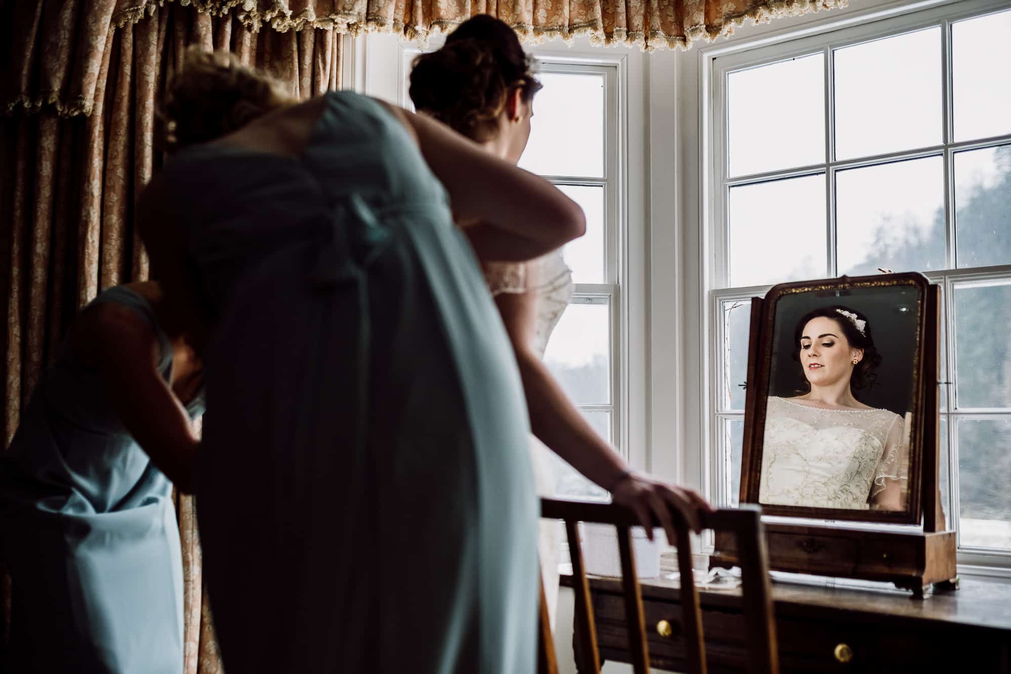 A photo of the bride in her dress at the Inn at Whitewell