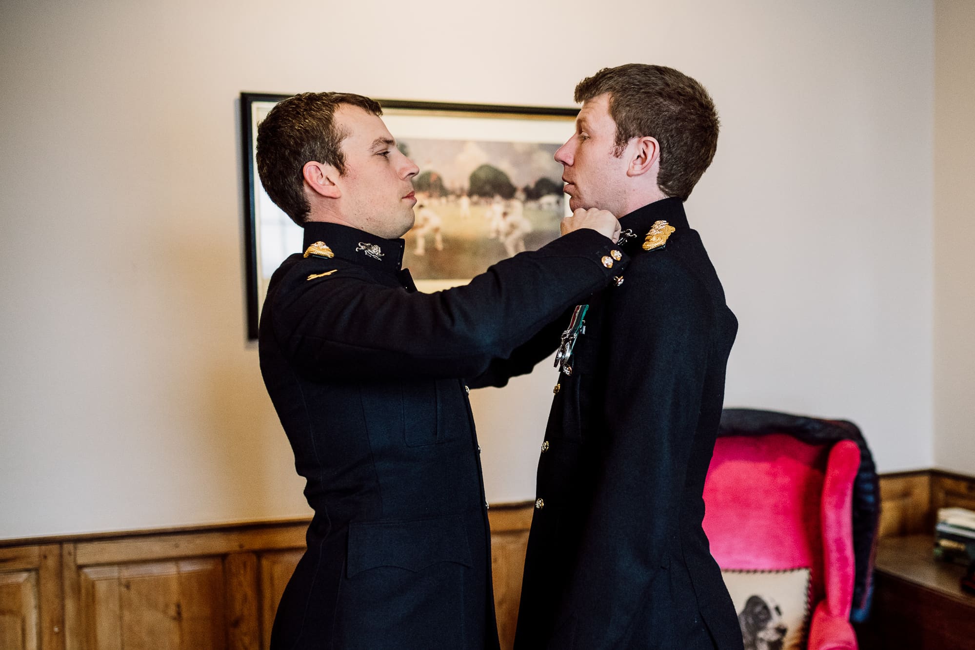 Groom and his best man getting dressed. 