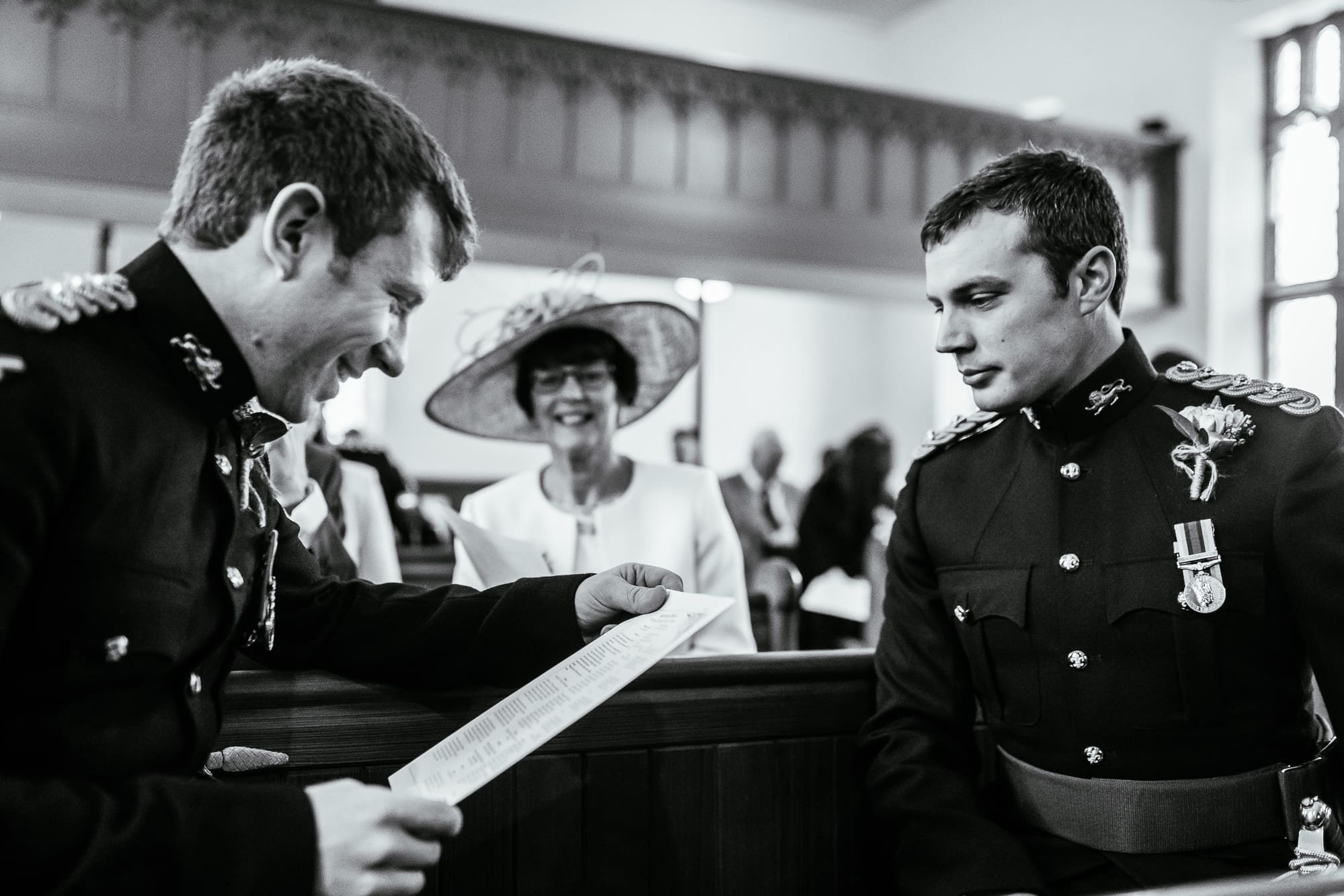 The groom waiting with his mum laughing in the background