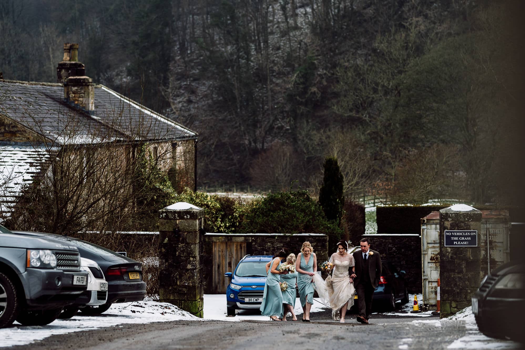 The bride and her bridesmaids walking to the church