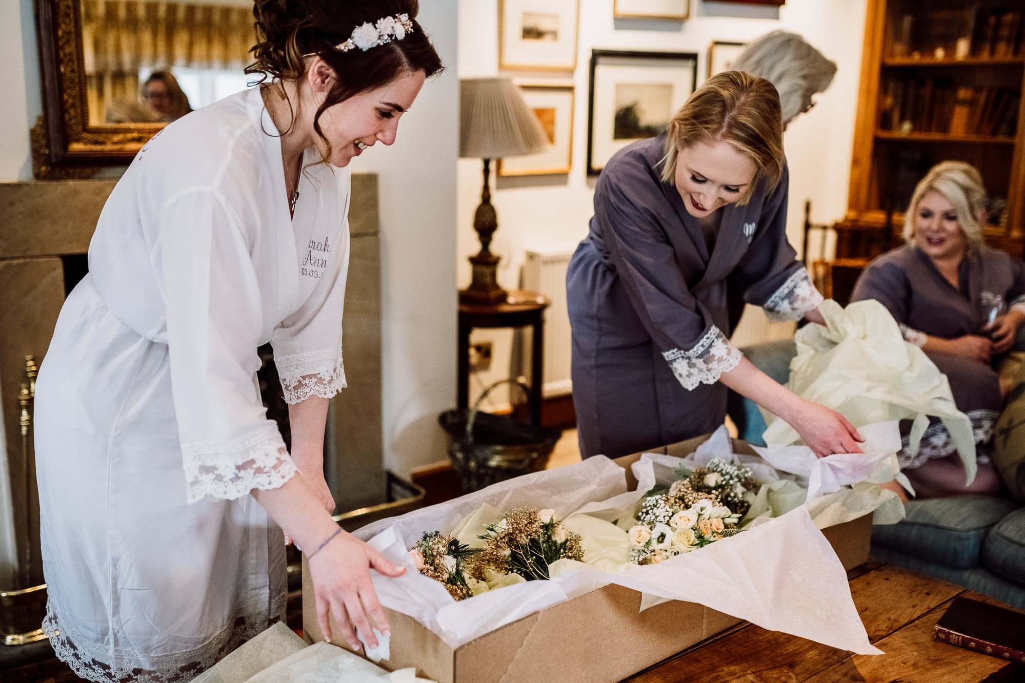 The bride to be and her sister looking at the flowers for the first time