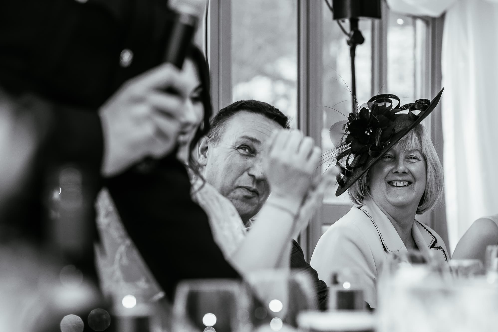 Mother of the bride laughing during speeches