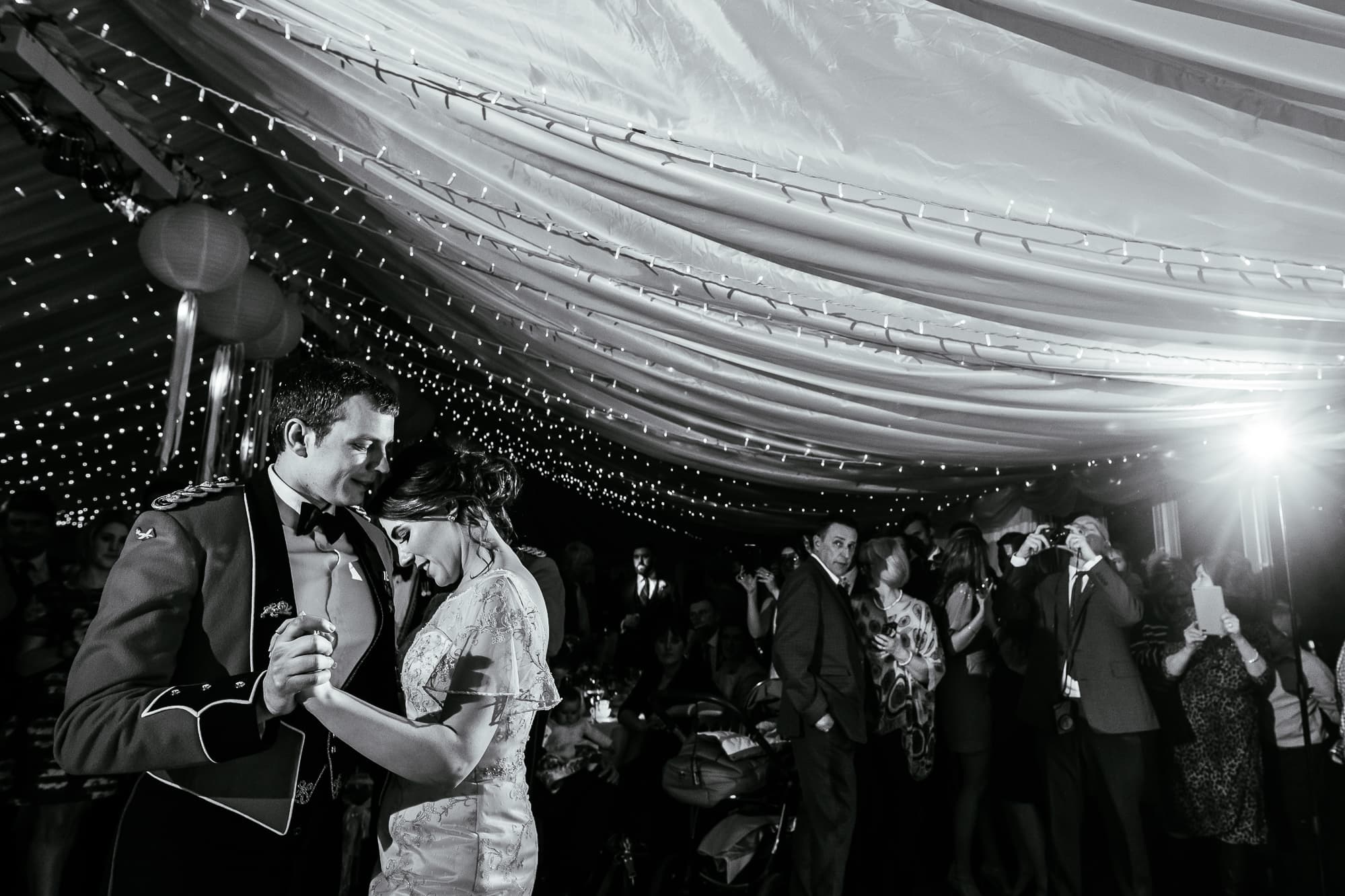 A black and white photo of the bride and groom dancing at the Inn at Whitewell