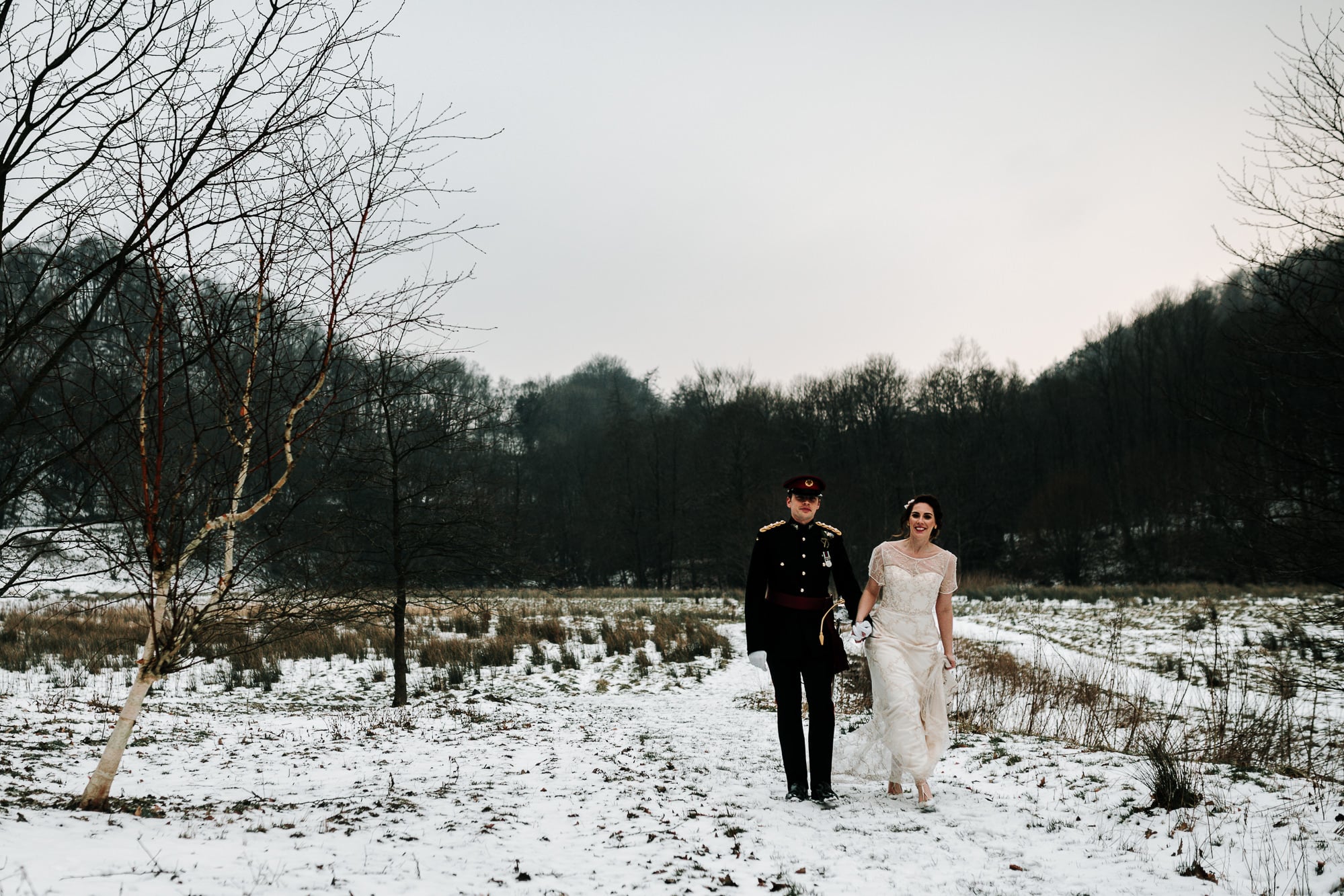 The couple walking in the snow