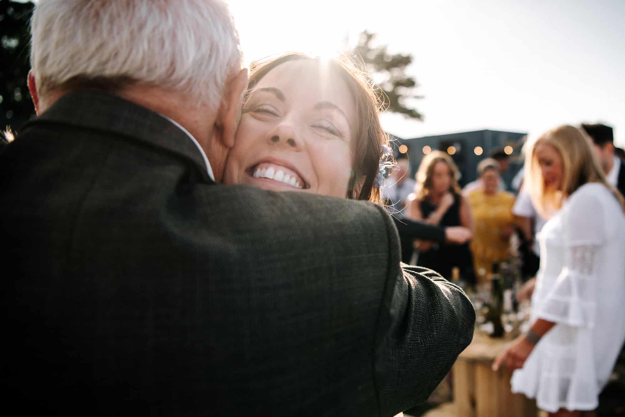 bride hugging her father in law