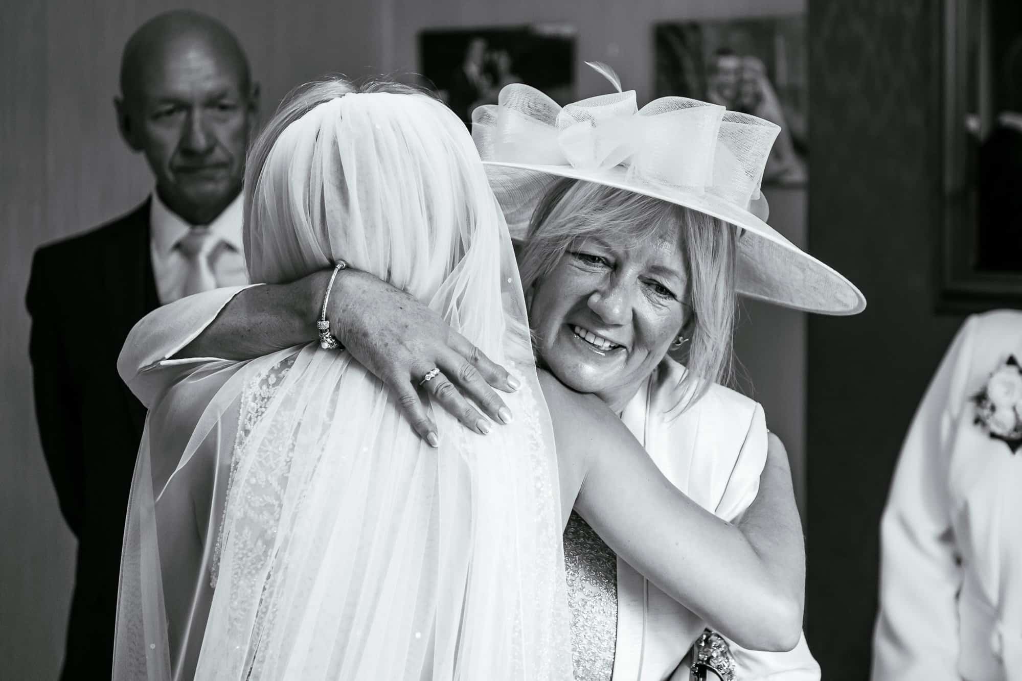 Bride hugging her mum