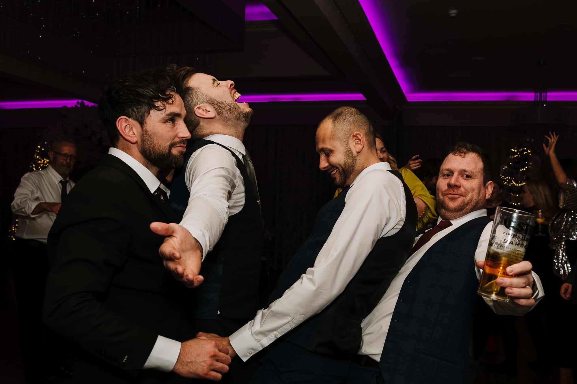 Groom and his friends dancing