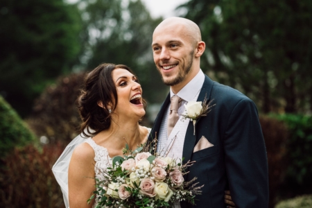 Bride and groom smiling