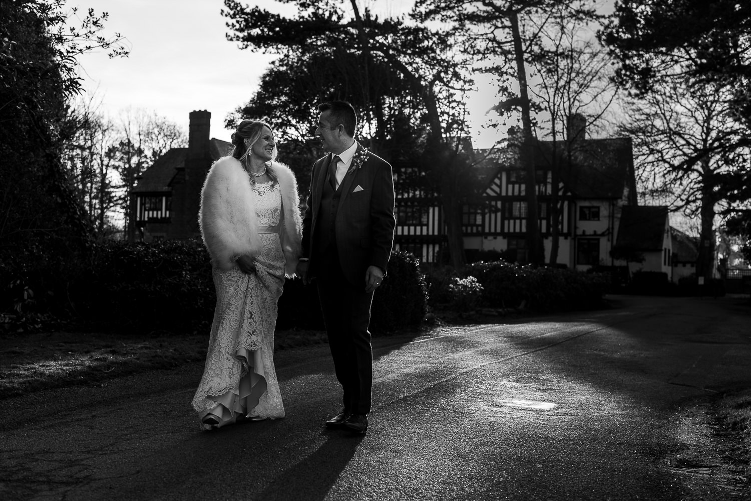 Bride and groom walking in the sun