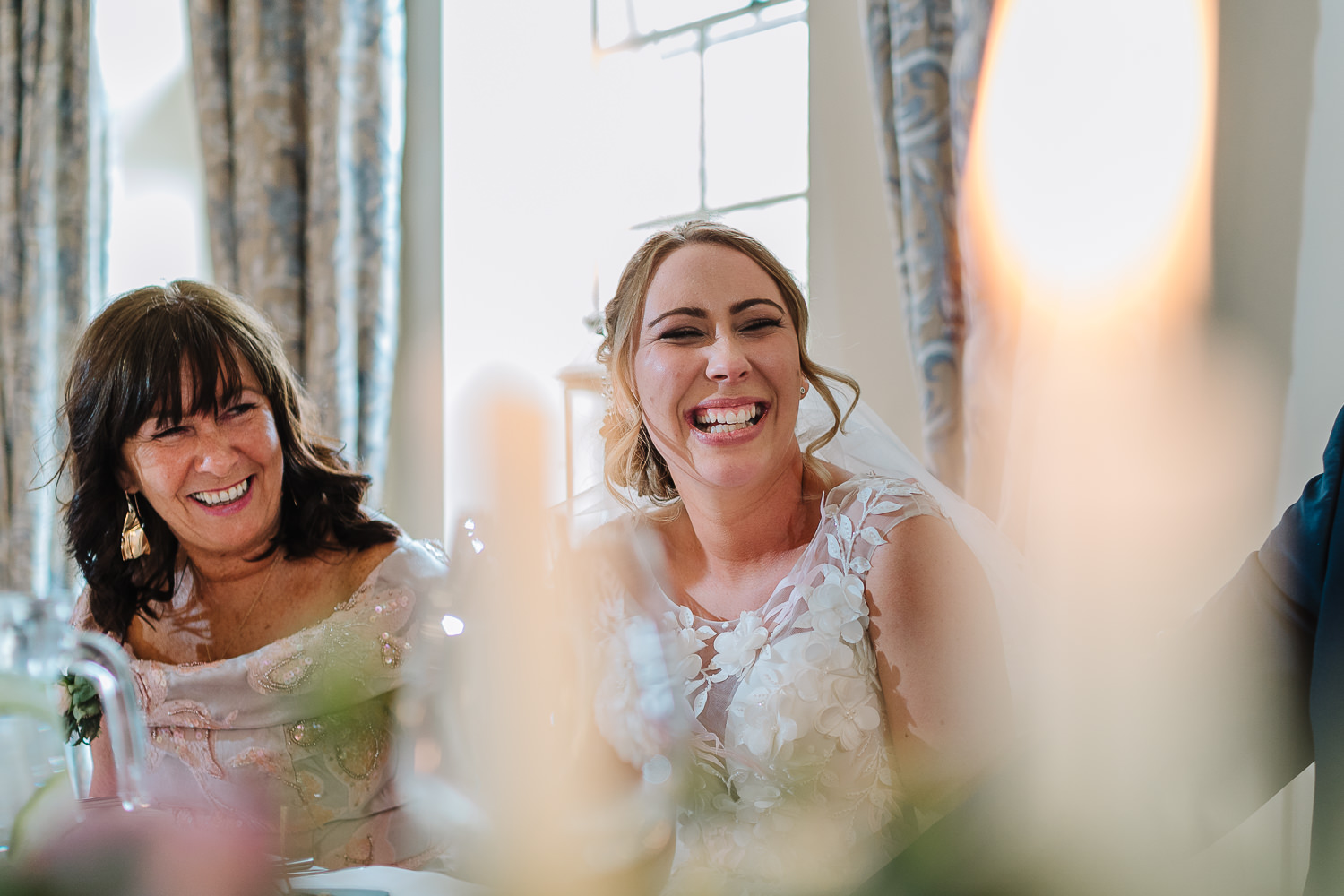 bride and her mum laughing