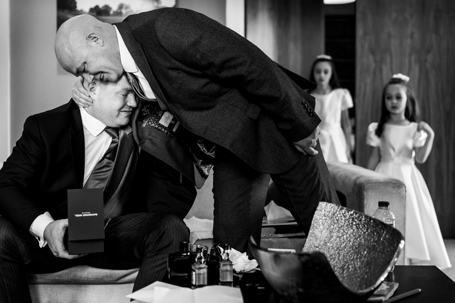 Groom being embraced by his dad.