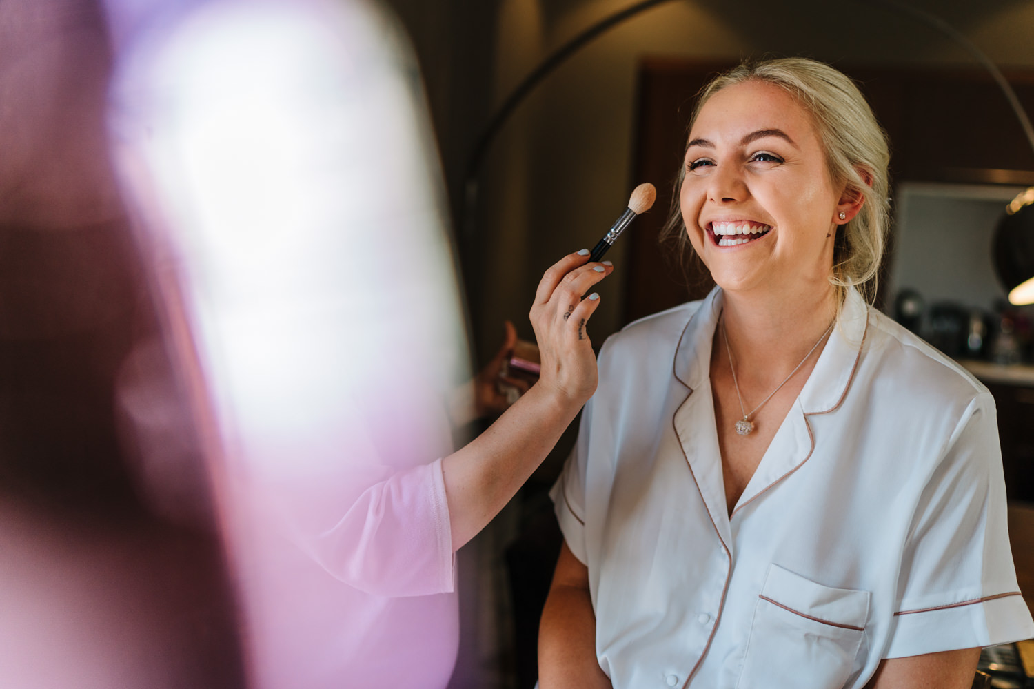 Bride having her make up done