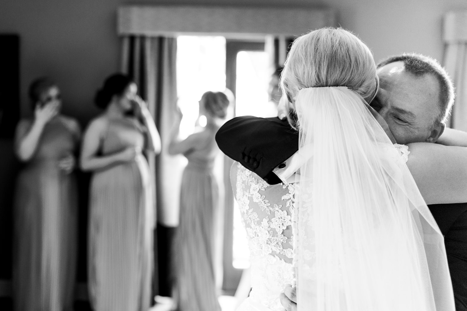 Brides uncle embracing her