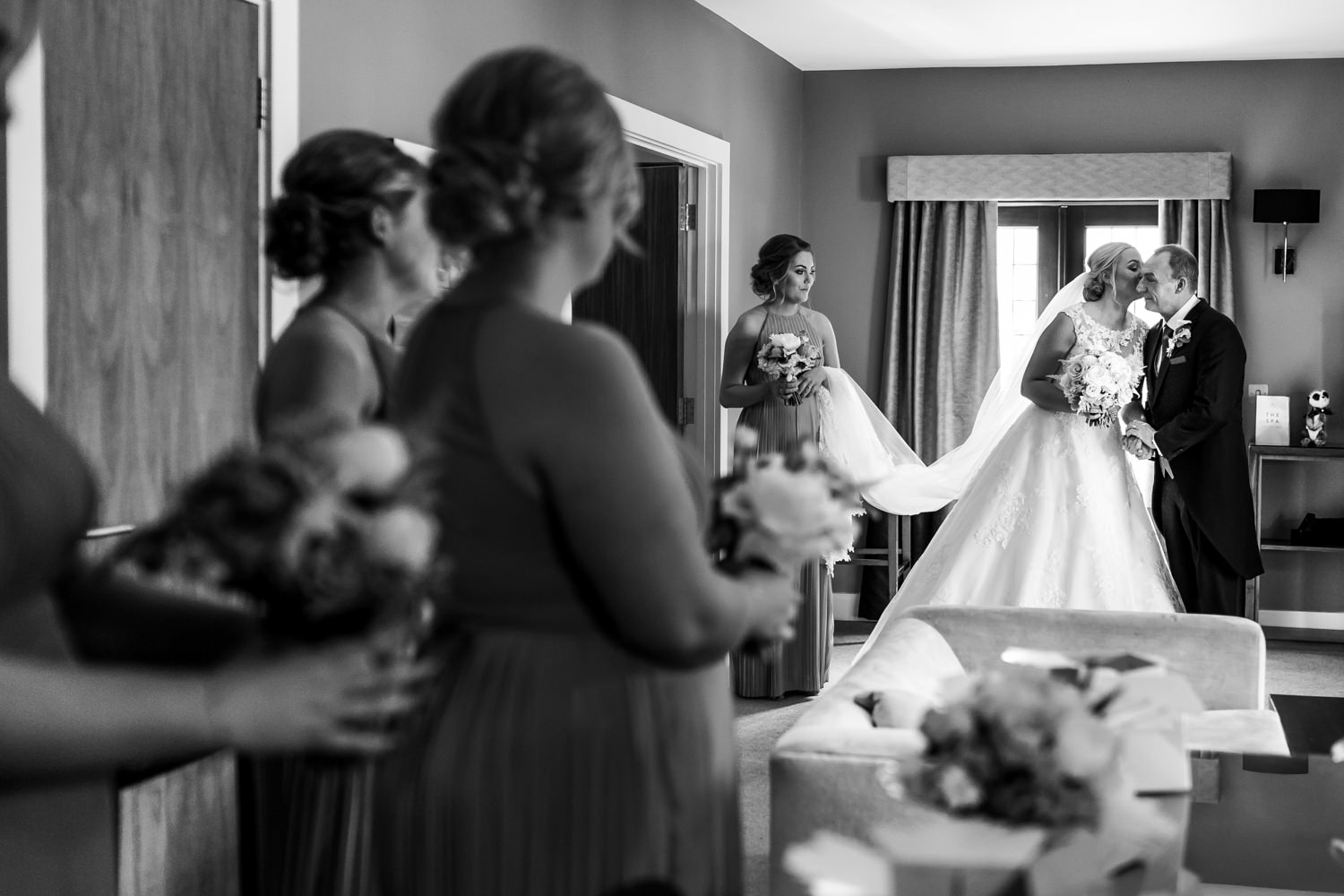 Bride and her uncle kissing before going to the ceremony