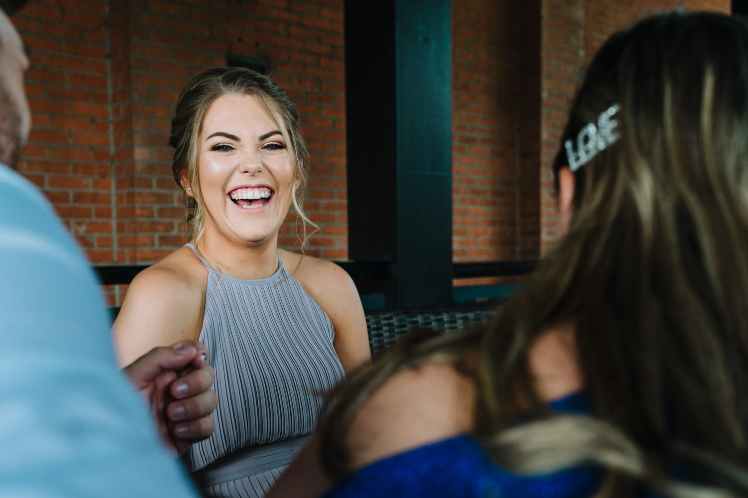 Bridesmaid laughing